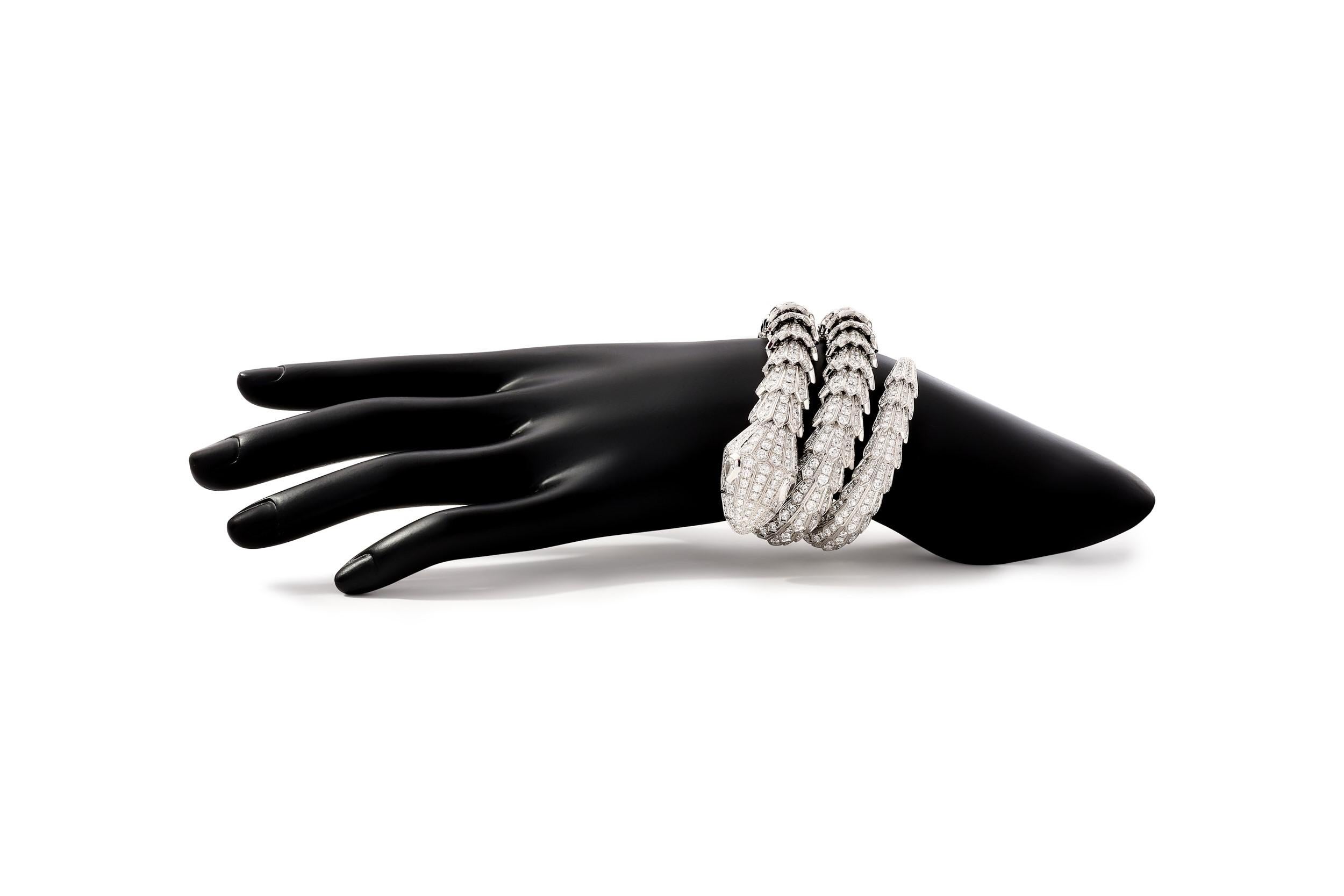 Bulgari Serpenti diamond snake bracelet in 18k white gold, accompanied by Bulgari box.

This prominent Bulgari Serpenti piece features approximately 49.56 carats of round brilliant cut diamonds pave set over the entirety of the bracelet, as well as