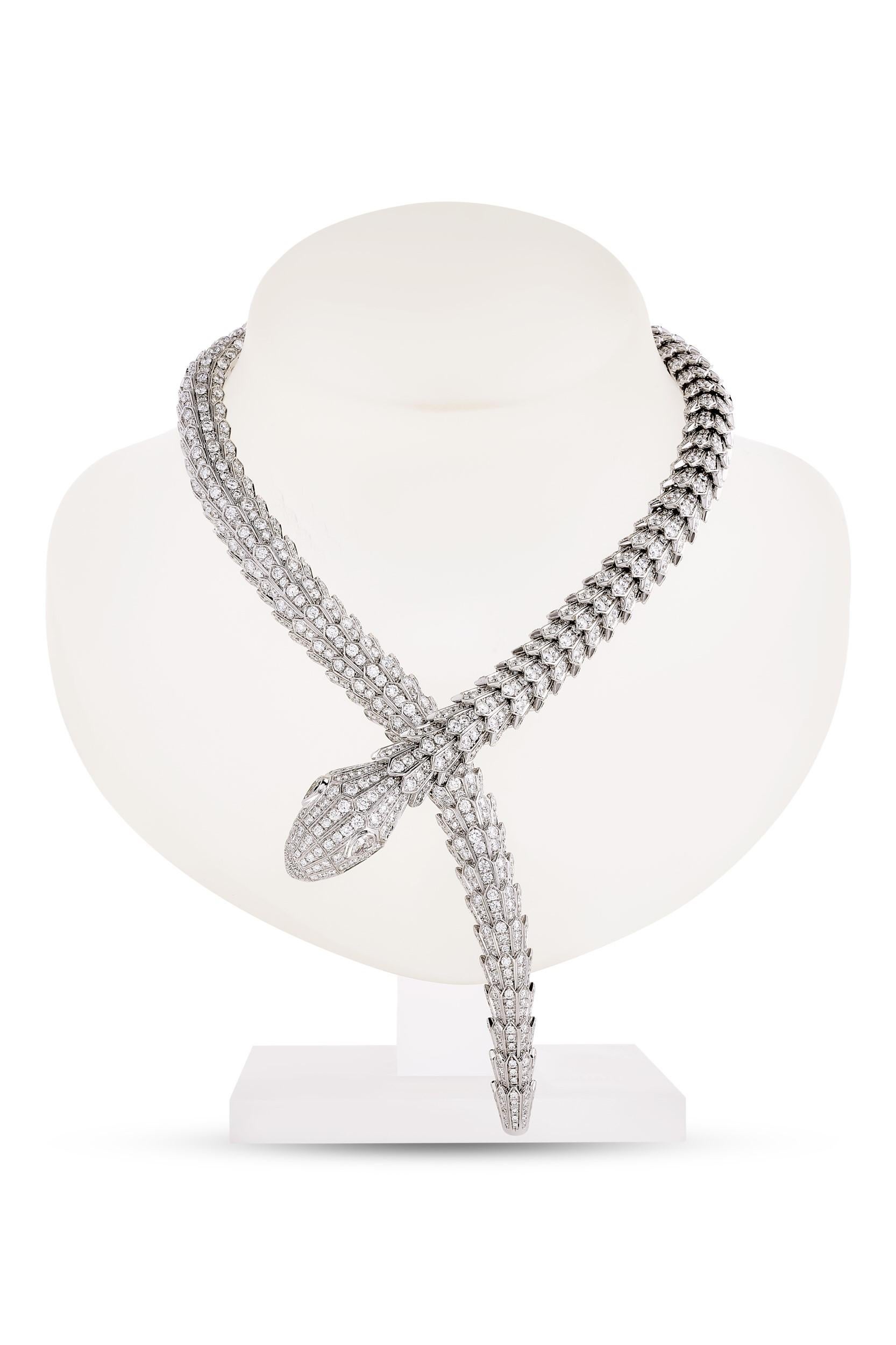Bulgari Serpenti diamond snake necklace in 18k white gold, accompanied by Bulgari box.

This striking Bulgari Serpenti piece features approximately 73.81 carats of round brilliant cut diamonds pave set over the entirety of the necklace, as well as 2