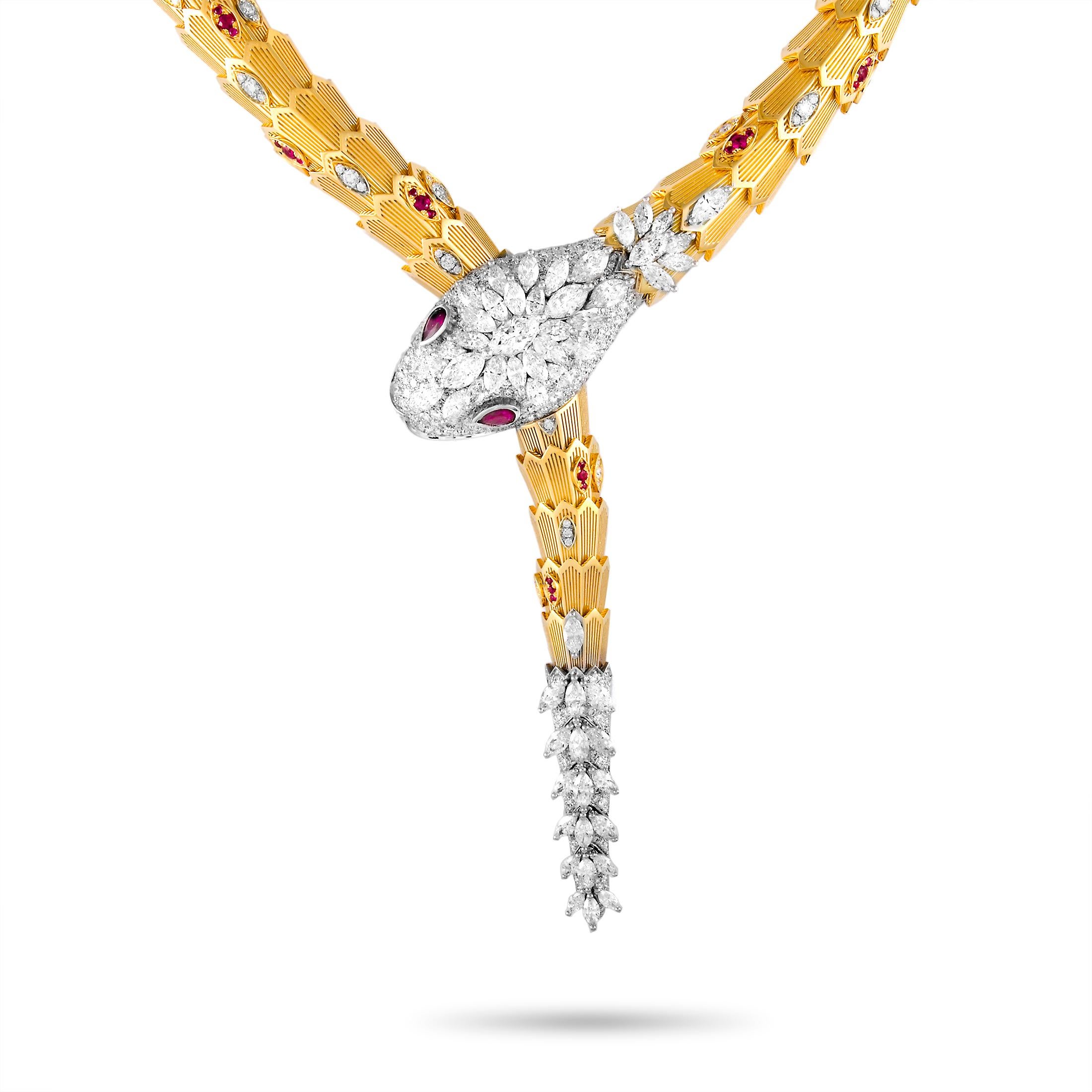 The Bvlgari “Serpenti” necklace is made out of 18K yellow and white gold and weighs 260.3 grams. It is set with diamonds that total 19.95 carats and with rubies that amount to 2.52 carats. The necklace measures 18.50” in length and boasts a 6”