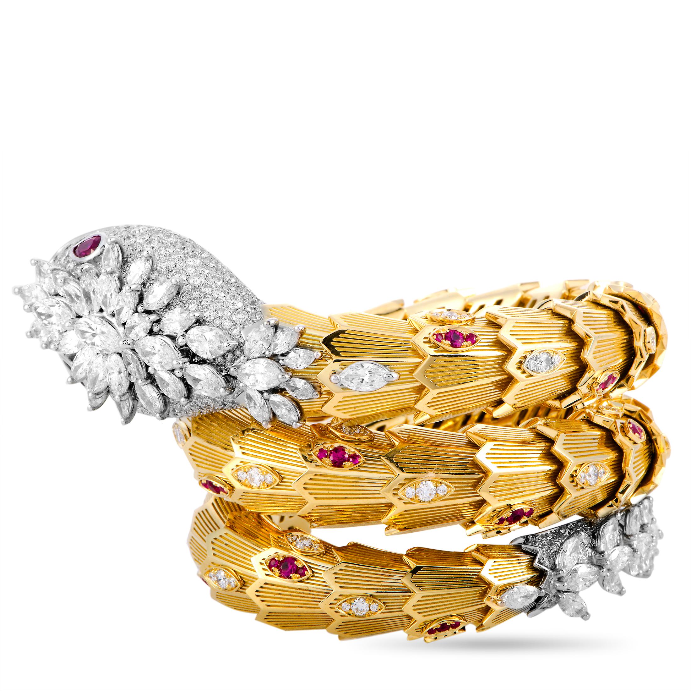 The Bvlgari “Serpenti” bracelet is made out of 18K yellow and white gold and weighs 231.5 grams. It is set with diamonds that total 18.90 carats and with rubies that amount to 1.64 carats. The bracelet measures 6.28” in length and boasts a 2”