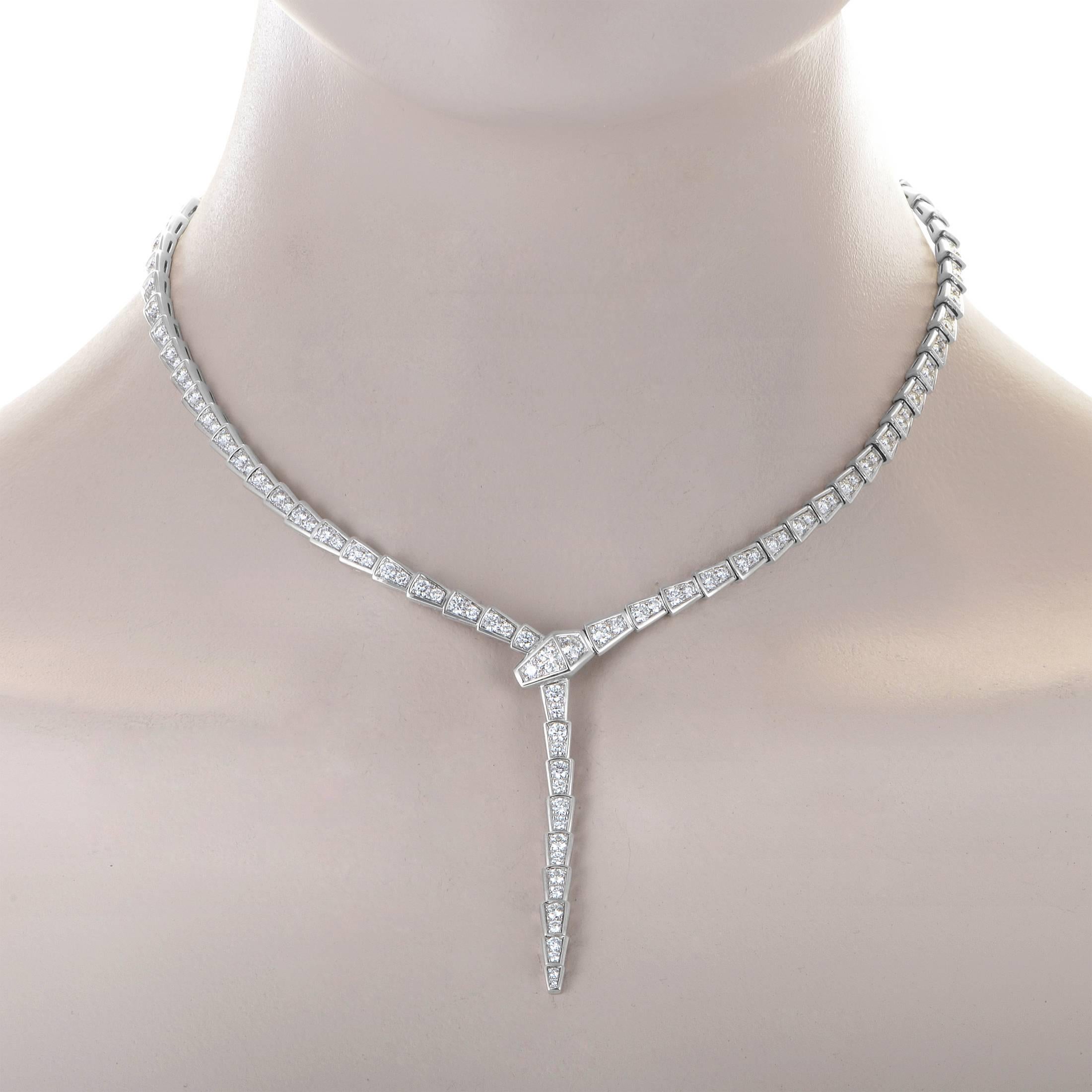 This piece from Bvlgari's Serpenti collection is made of 18K White Gold and had a full diamond pave. The brillant white diamonds weigh 8.50 carats.
Included Items: Manufacturer's Box and Papers