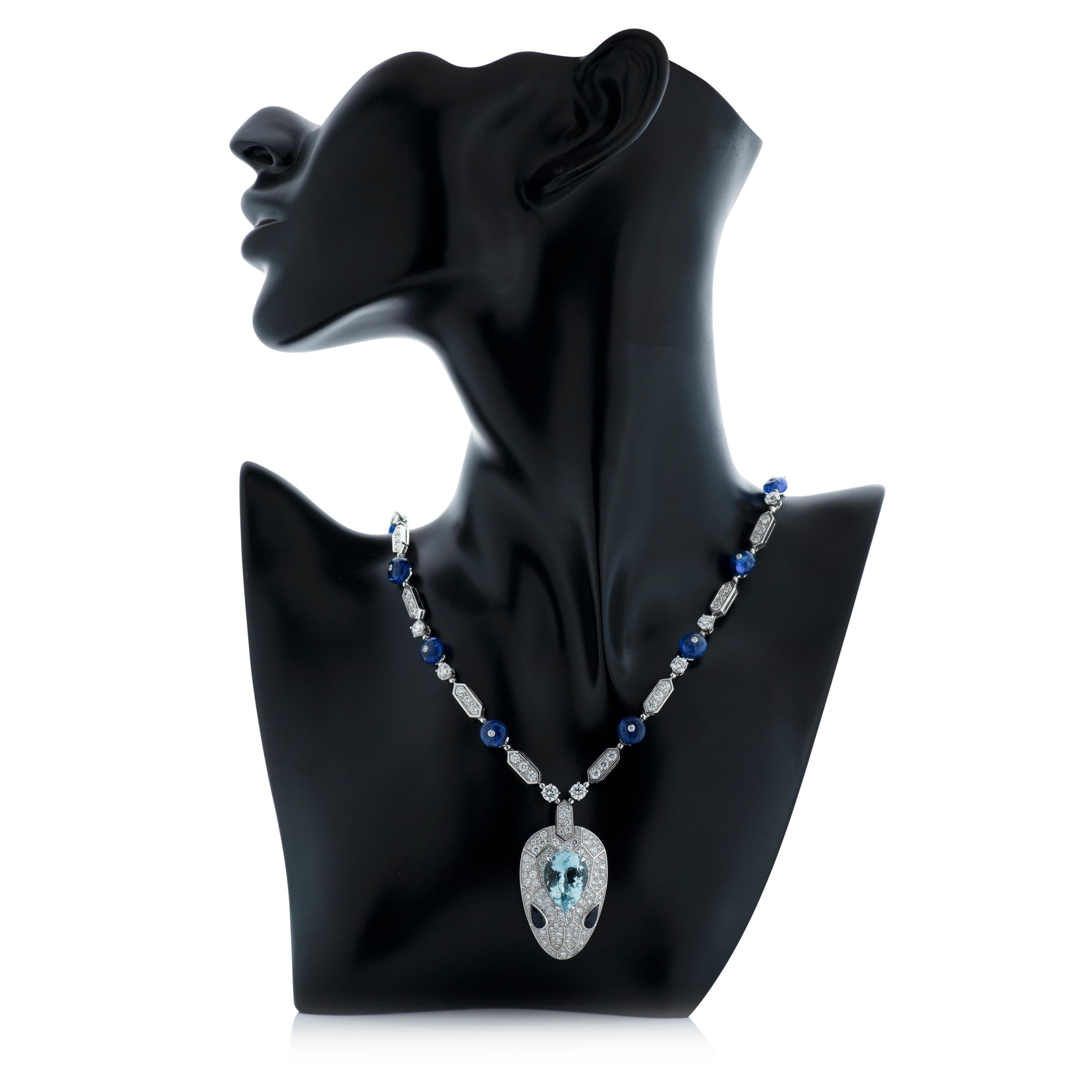 Bulgari Serpenti Seduttori diamond, aquamarine, sapphire and tanzanite snake head necklace in 18k white gold.  Accompanied by Bulgari box and certificate of authenticity. 

The snake head drop measures approximately 46mm long and 25mm wide.  It is