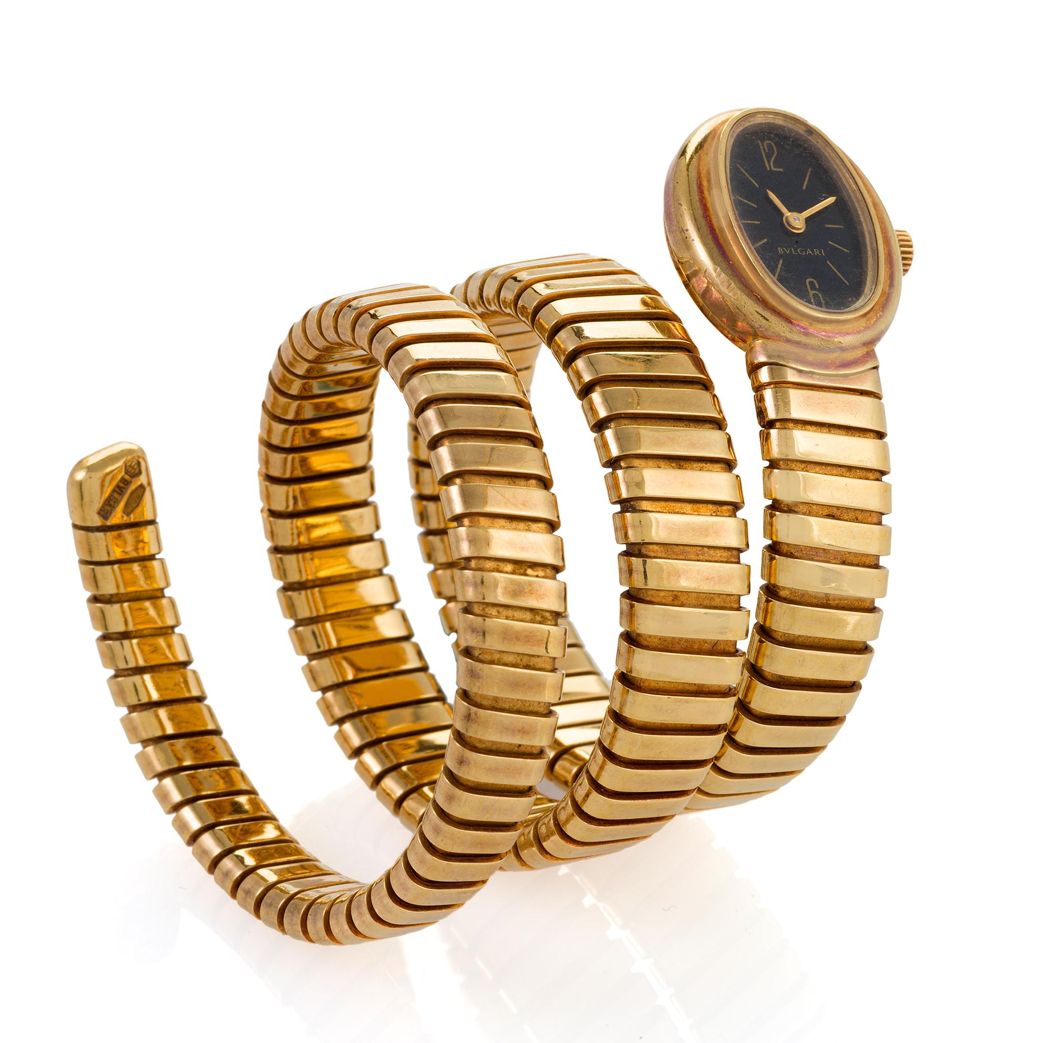 A refined and abstract design by Bulgari, Rome, this 1970s Serpenti watch is set into a coiled bracelet composed of highly flexible gold. Designed to wrap like a serpent around the arm, the spiraling bracelet is formed of tubogas links simulating