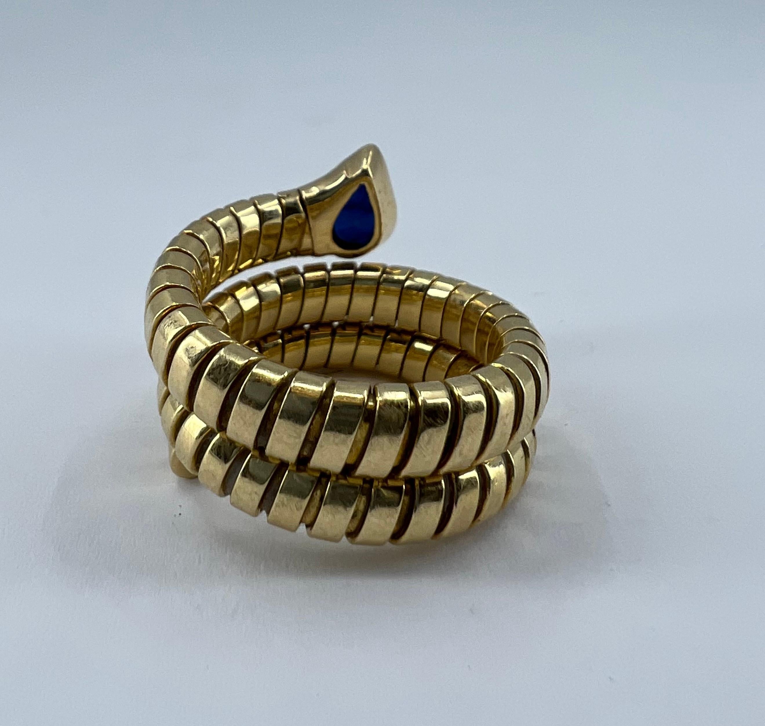 DESIGNER: Bulgari
CIRCA: 1980’s
MATERIALS: 18K Yellow Gold
GEMSTONE: 0.5 cts. Sapphire
WEIGHT: 15.6 grams
RING SIZE: 6.25- 7.25
HALLMARKS: BVLGARI, 750

A beloved Serpenti Tubogas rign by Bulgari, made of 18k gold, features sapphire.

A recognizable