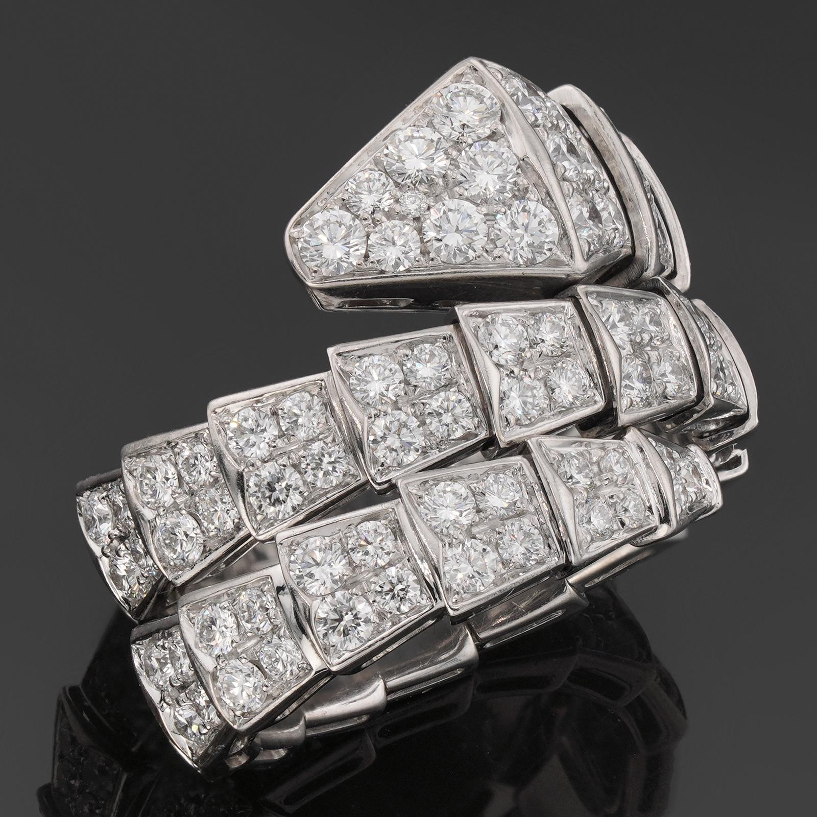 This magnificent 2-row ring from Bulgari's alluring Serpenti collection is crafted in 18k white gold and fully pave-set with round brilliant-cut round E-F-G VVS1-VVS2 diamonds of an estimated 2.92 carats. The ring is slightly adjustable from size
