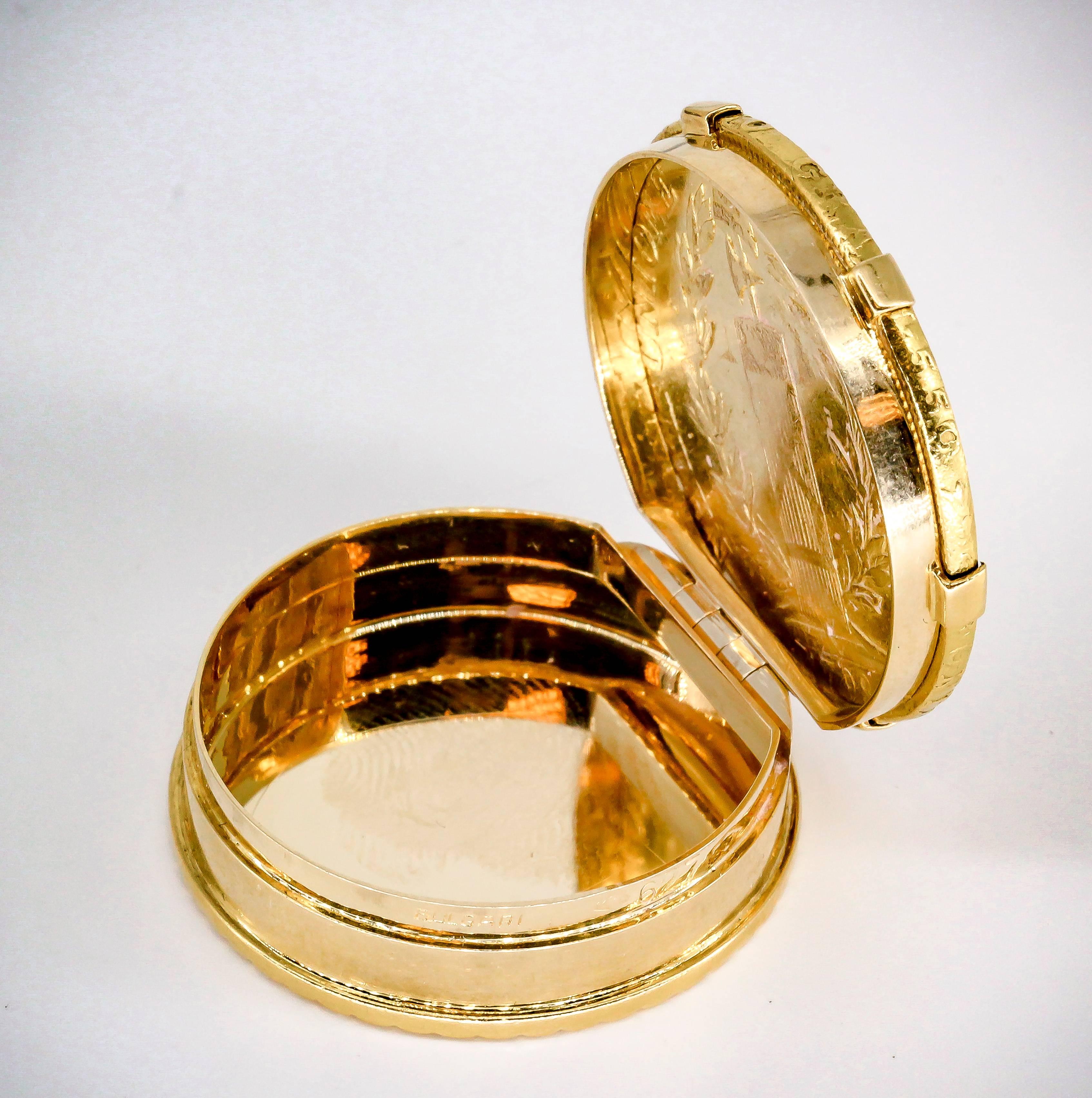 Stylish yellow 18K gold pill box by Bulgari with an ancient Italian 22K gold coin as the top. Coin is from 1798-1805 and it's 96 lire (Italian currency). The pill box is built around the coin in 18K yellow gold, with circularly ribbed
