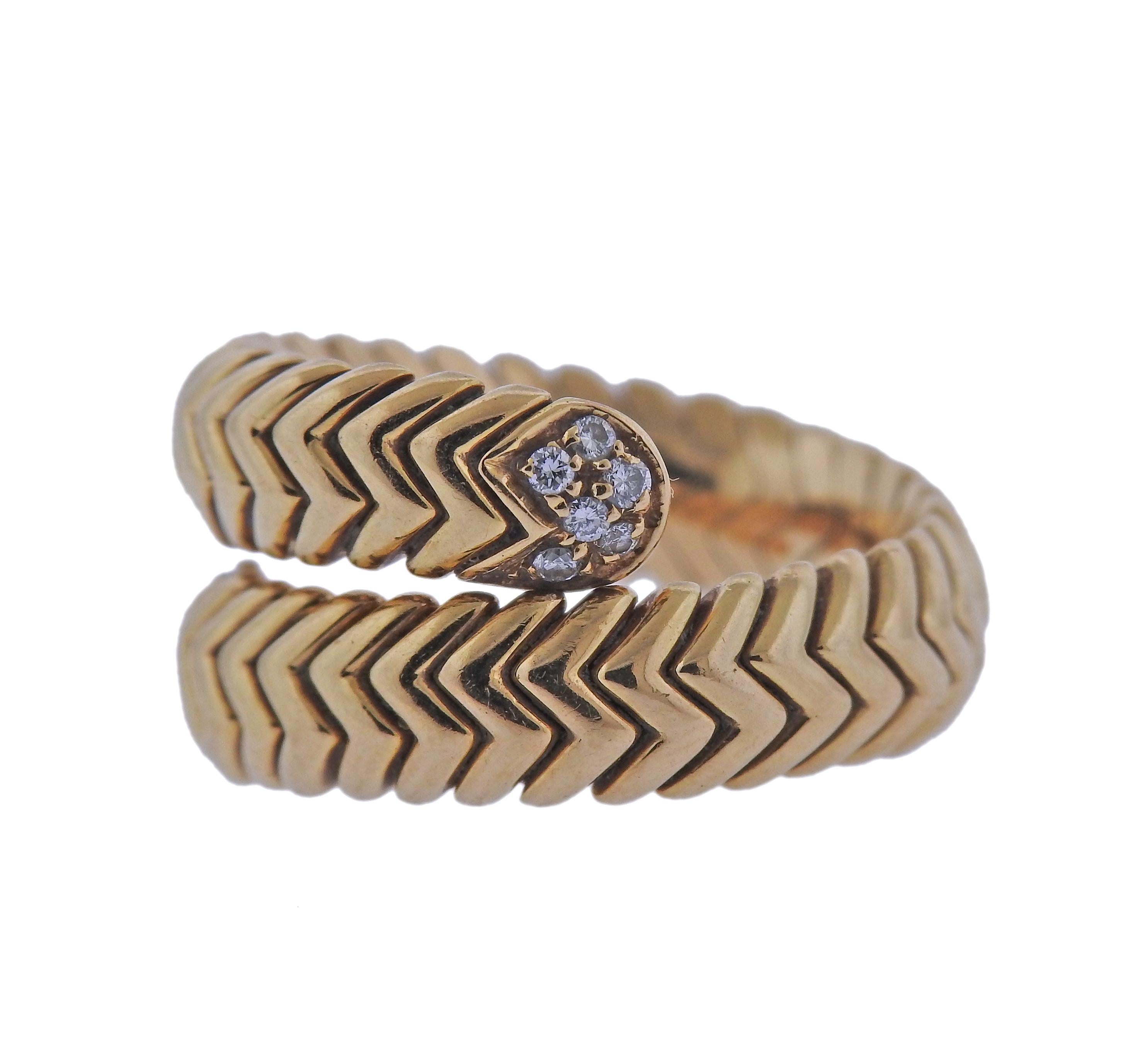 18k gold Spiga wrap ring by Bvlgari, adorned with approx. 012ctw in G/VS diamonds.  Ring size - 6,.25 ring is 12mm wide. Weight - 13.2 grams. Marked: Bvlgari, Italian mark, 750, made in Italy. 