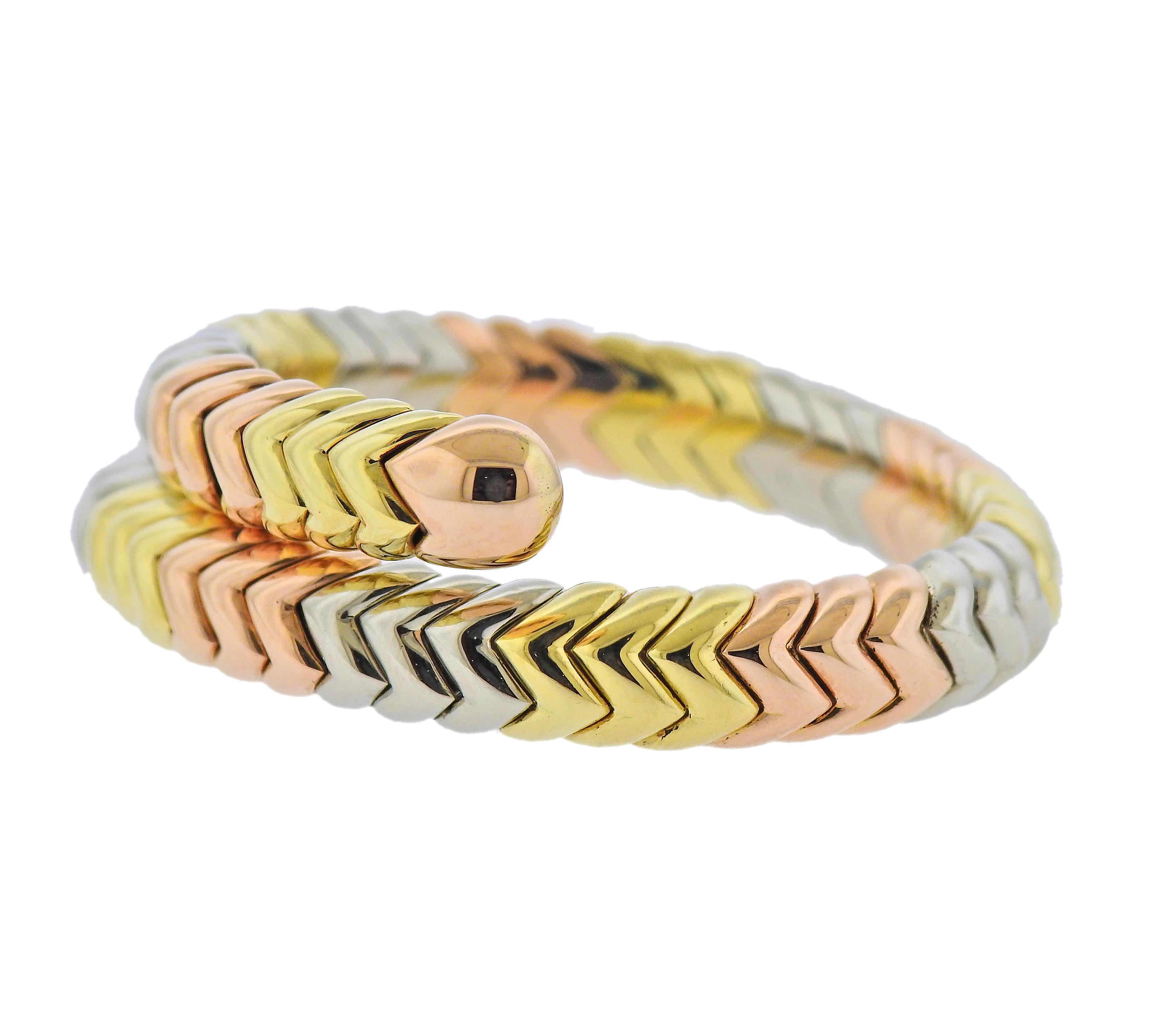 18k tri color gold Spiga wrap bracelet by Bvlgari. Bracelet will fit approx. 6-6.5