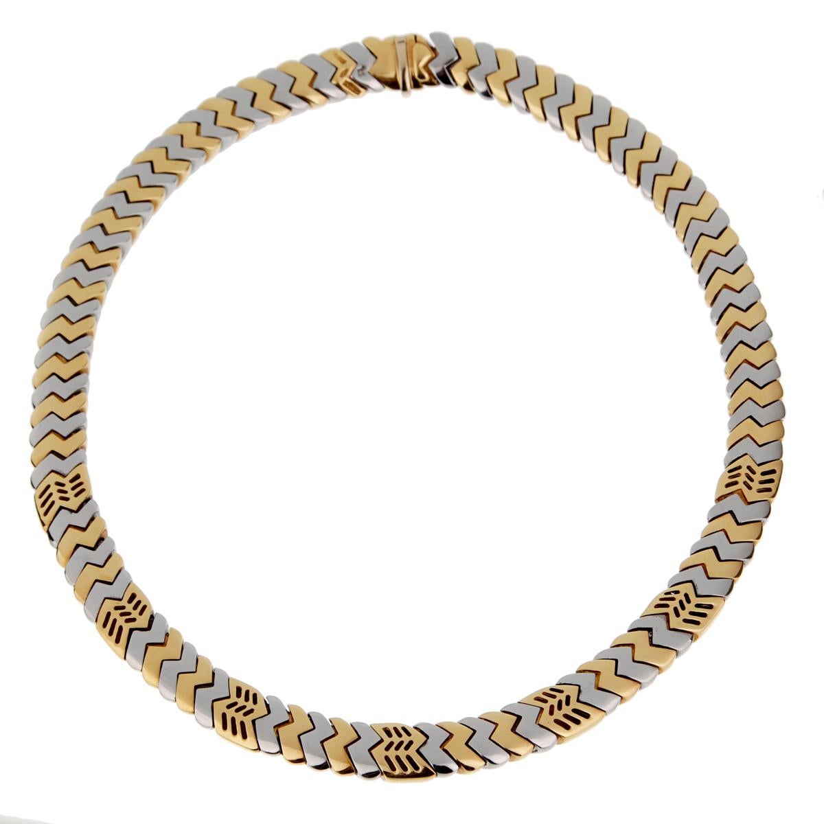 An iconic Bulgari yellow gold necklace from the Bulgari Spiga collection. The necklace consists of alternating yellow and white chevrons interlinked together. The necklace measures 15 1/2 inches long and .39