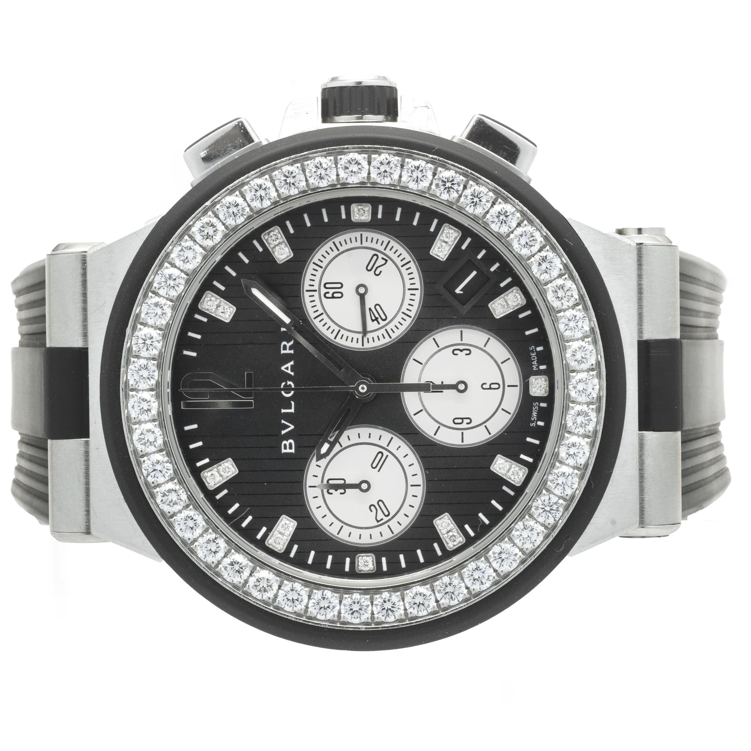 Movement: automatic
Function: hours, minutes, seconds, date, chronograph
Case: 40mm round case, factory diamond bezel 
Band: black rubber strap, buckle clasp
Dial: black chrono dial, diamond markers
Serial #: L0XXX
Reference #: DG40SCCH

No box or