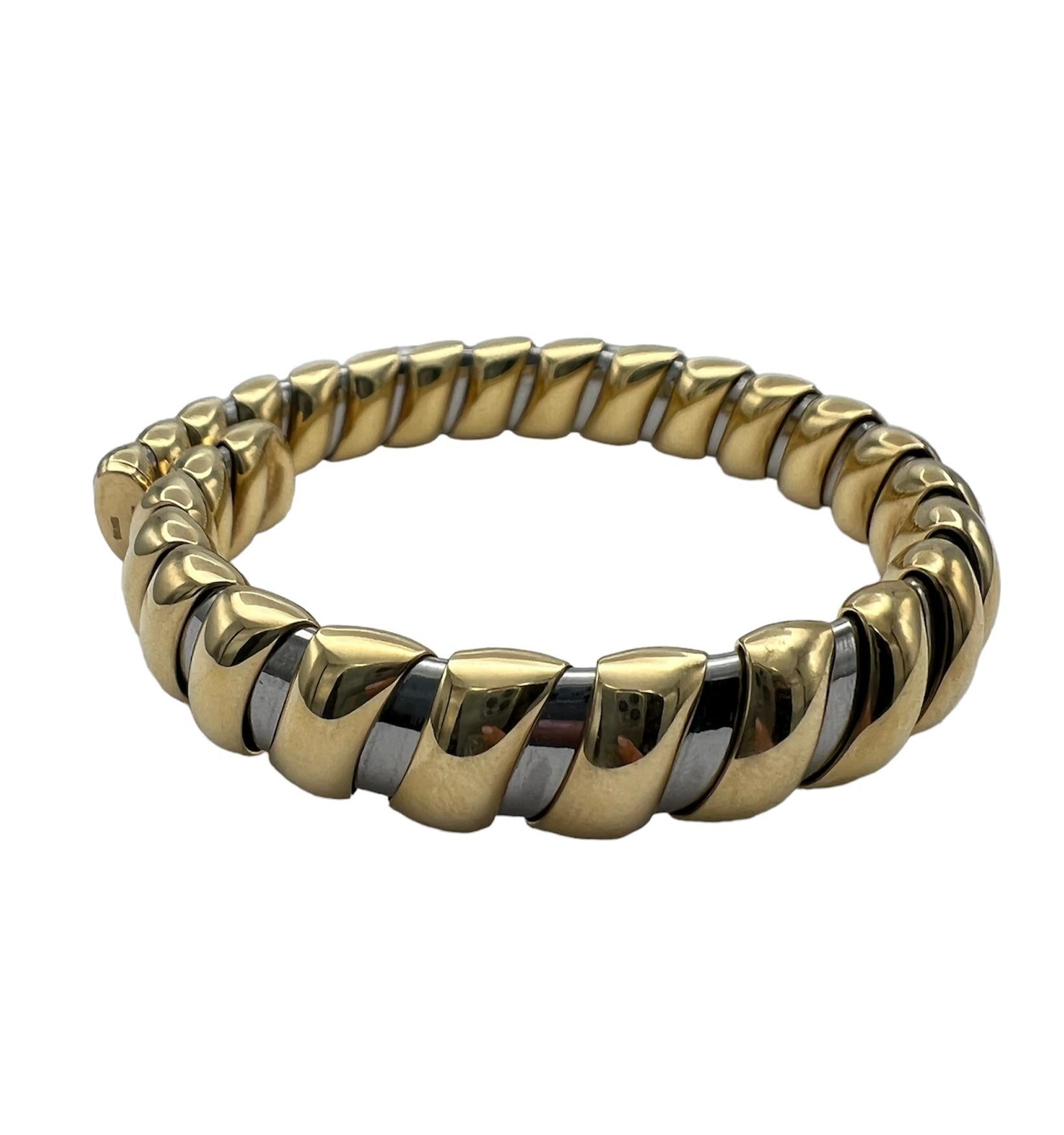 DESIGNER: Bulgari
CIRCA: 1980’s
MATERIALS: 18K Yellow Gold & Stainless Steel
WEIGHT: 52.8 grams
MEASUREMENTS: 7” x 3/8”
HALLMARKS: BVLGARI, 750
ITEM DETAILS:
A Bulgari stainless steel and 18k gold bangle bracelet.

The iconic Tubogas design is