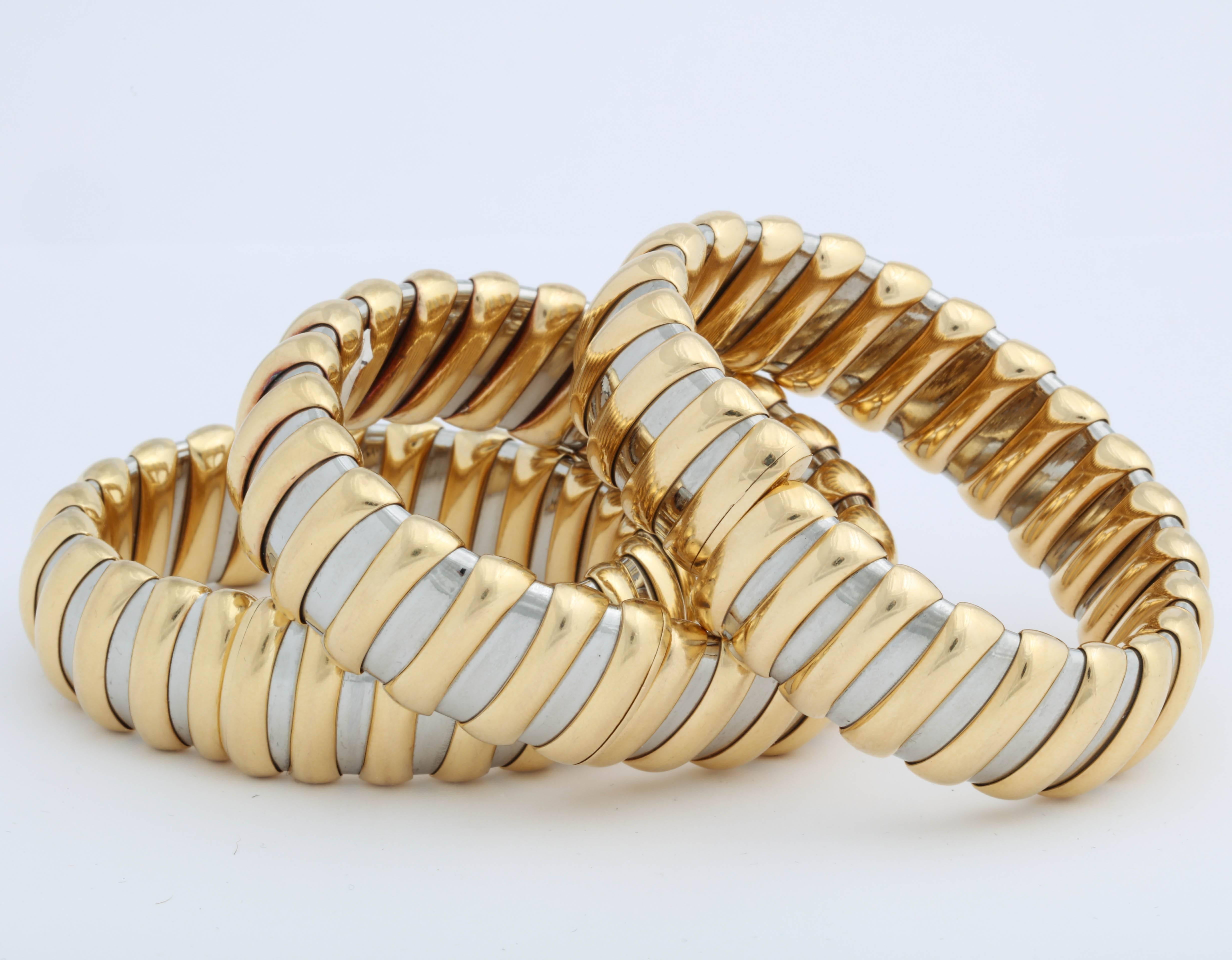 Matching set of 3 Bulgari Steel and Gold Bangles.  Sold as a Set or Singly or as a Pair.  Take your pick!  Very chic look - especially when combined with Bulgari Steel & Gold Collar which we list  on 1stdibs, as well.  Each marked in lozenge