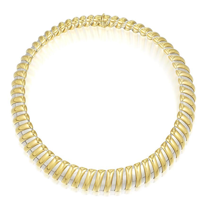 A chic Bulgari steel and 18 karat yellow gold necklace. Made in Italy, circa 1980.