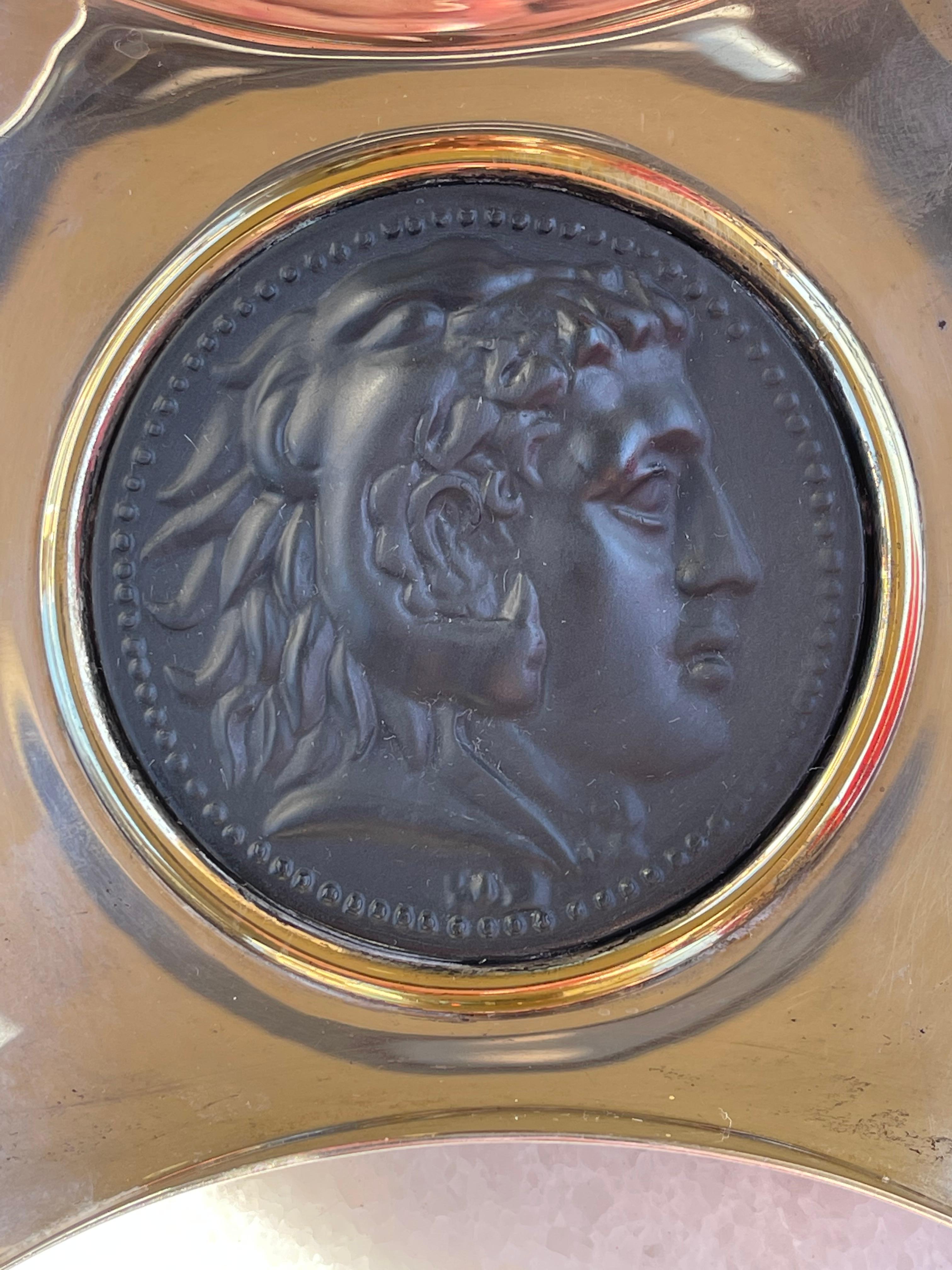 A neo-classical Bulgari sterling silver vide poche or catchall. It features a medallion mounted in the center. The inscription on the back dates the 323-336. Reads Alessandro Magnus for Alexander the Great. Stamped in bold on both sides Bulgari. It