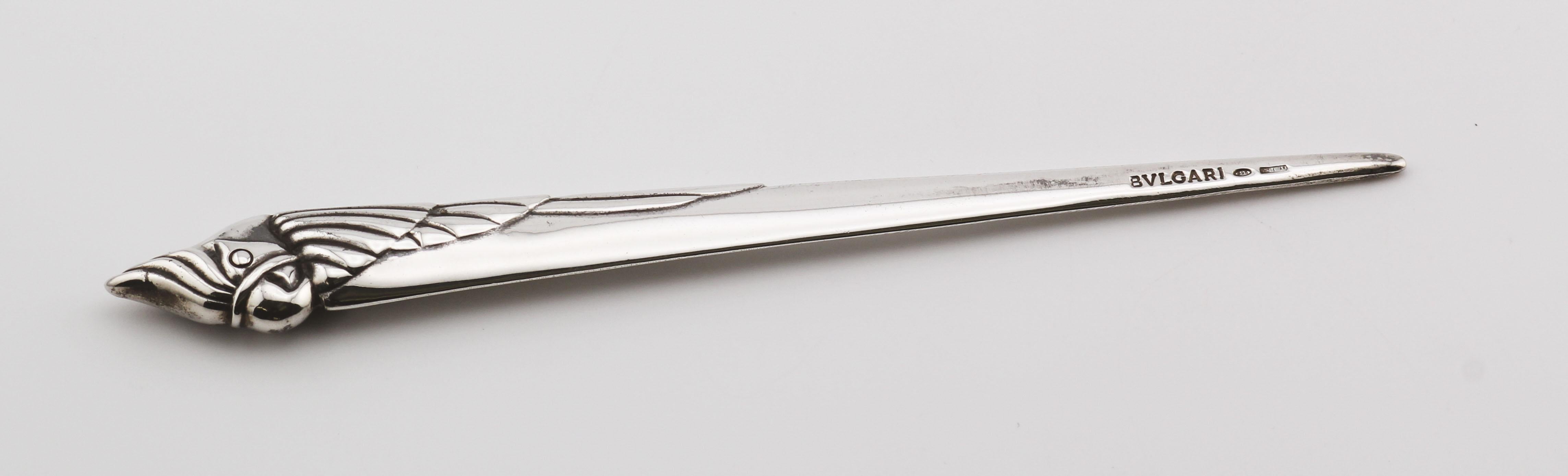 The Bvlgari Sterling Silver Vintage Cockatoo Bird Letter Opener is a luxurious and unique piece crafted by the renowned Italian luxury brand Bvlgari. This exquisite letter opener features a handle in the shape of a parrot bird, intricately detailed
