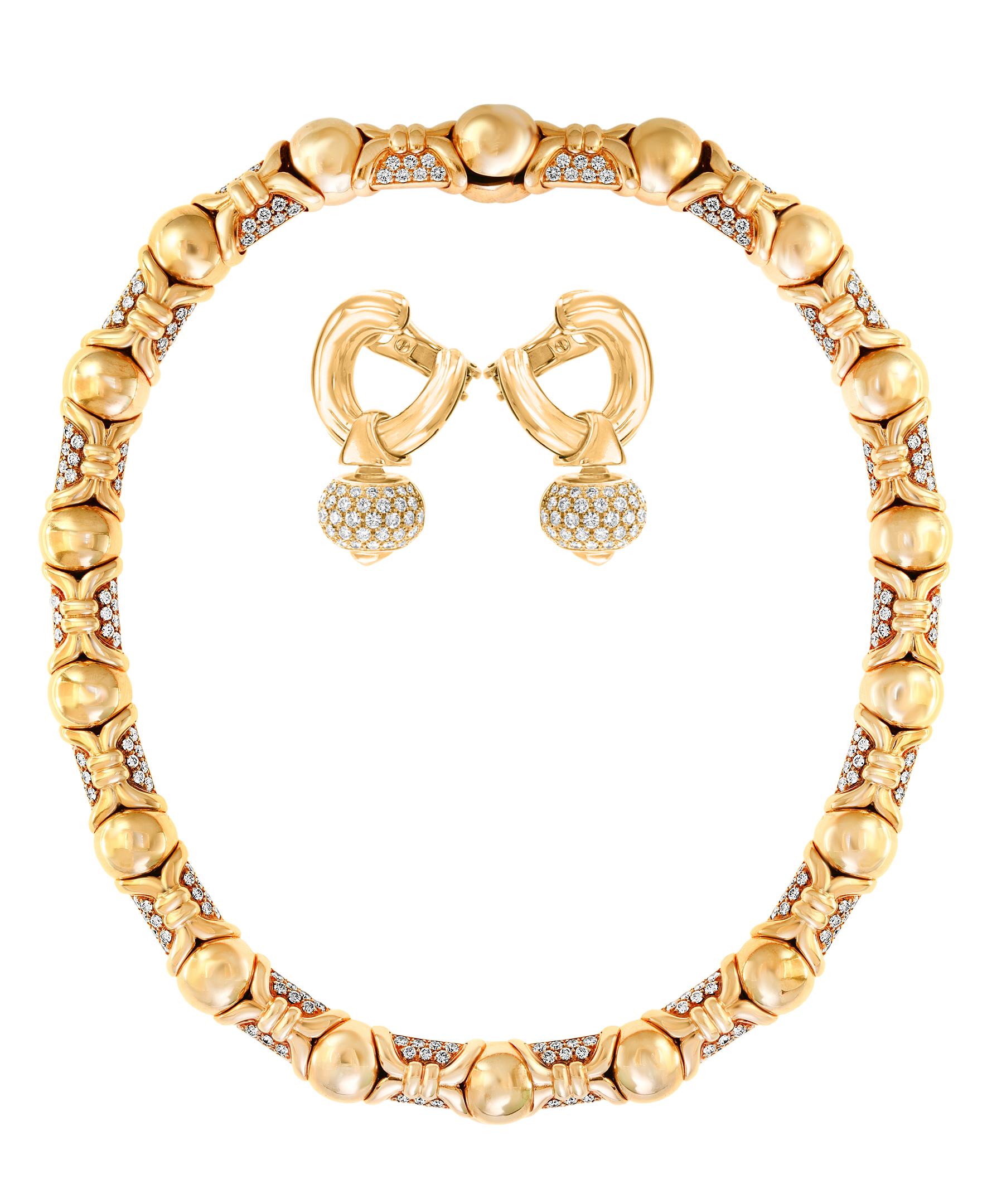 Bvlgari suite ,Necklace and Earrings in 18 karat gold and Diamonds.
A resplendent 1990's collar necklace by Bulgari, finely crafted with several rows of beaming pave-set brilliant-cut diamonds alternating with gold design.
The necklace comes with