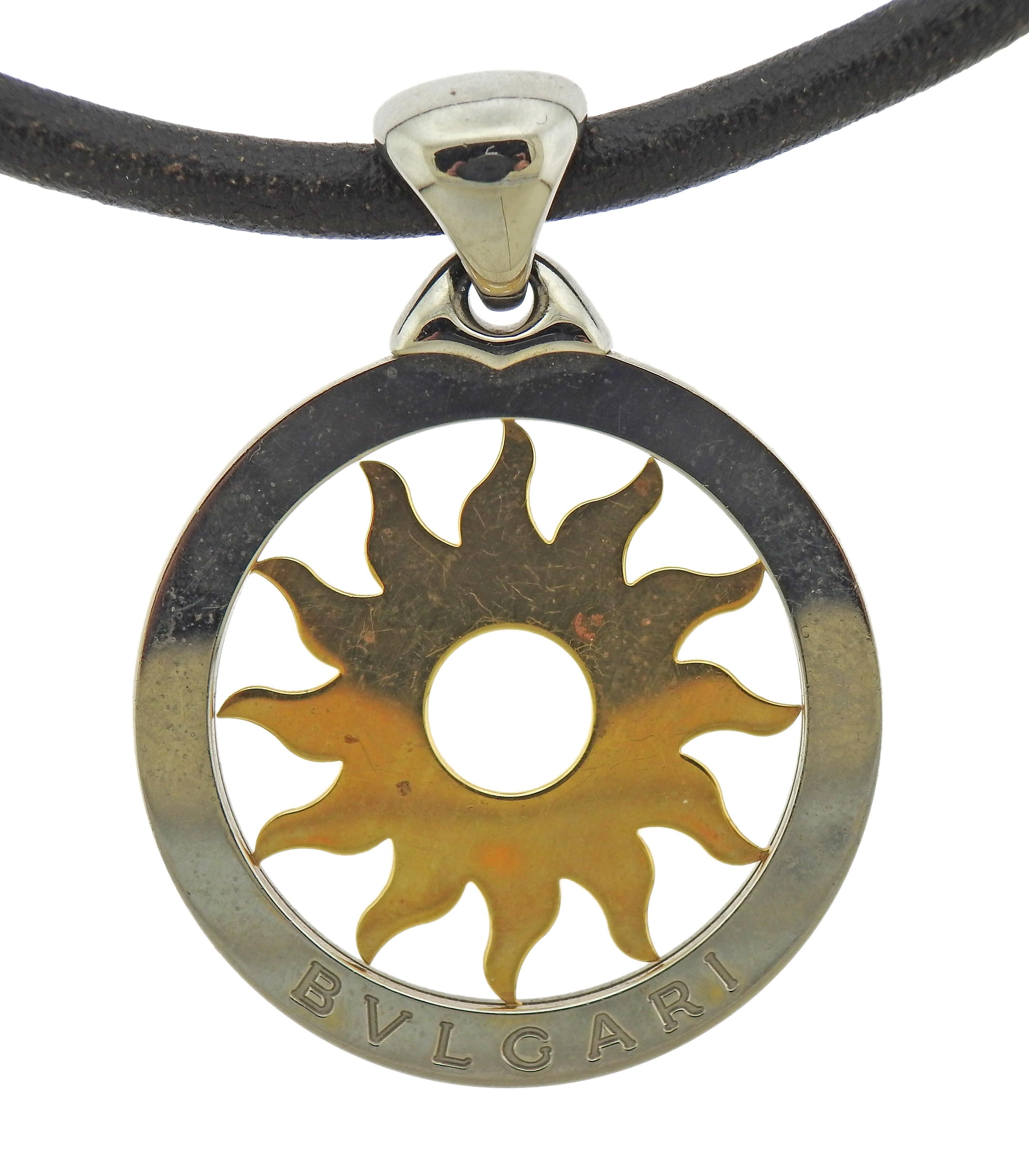 Bvlgari Tondo 18k gold and stainless steel sun pendant on an original leather cord necklace, with steel clasp. Necklace is 15.25