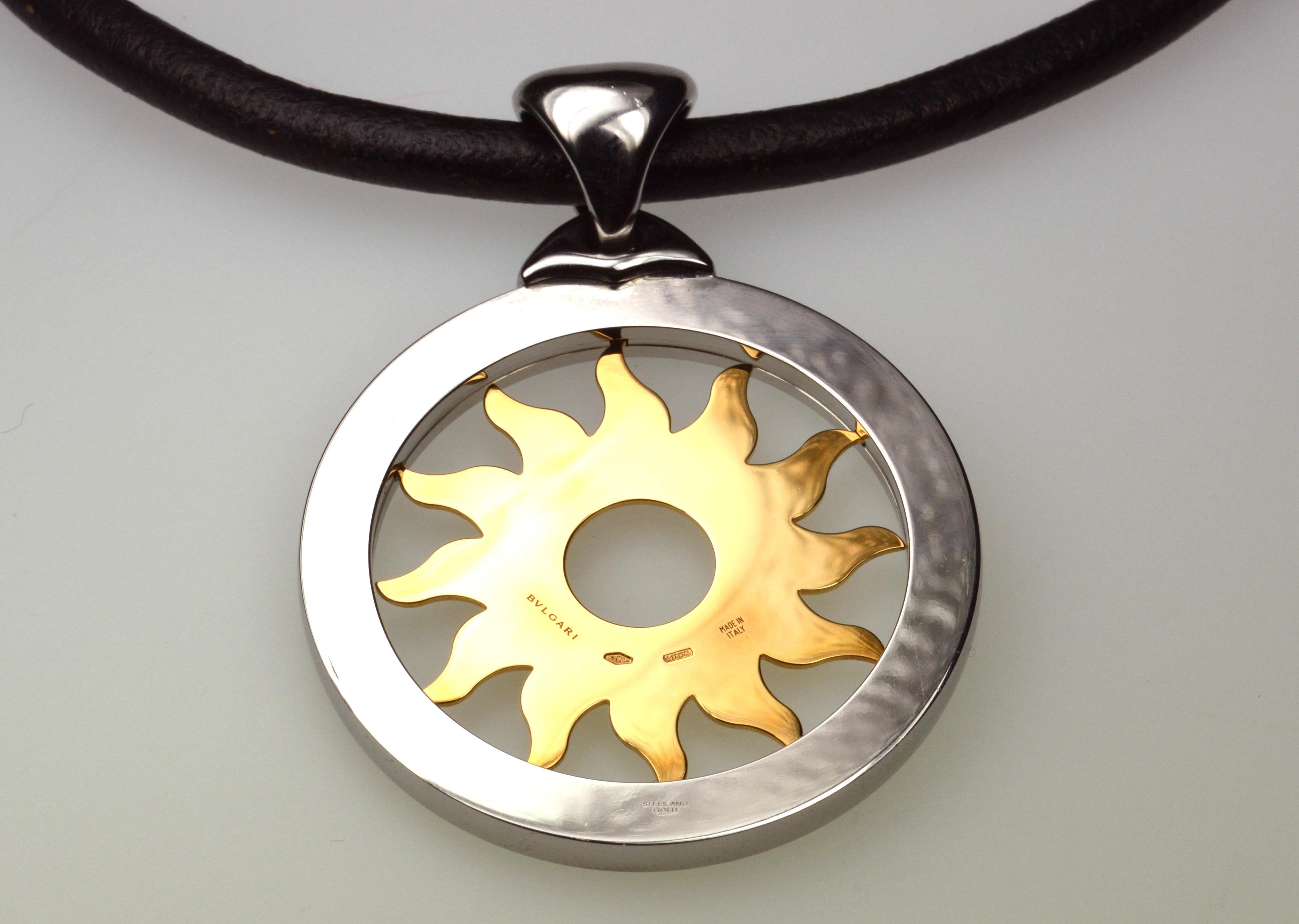 Bulgari Tondo Sun steel and 18K yellow gold pendant on a black leather cord
Signature: Bulgari