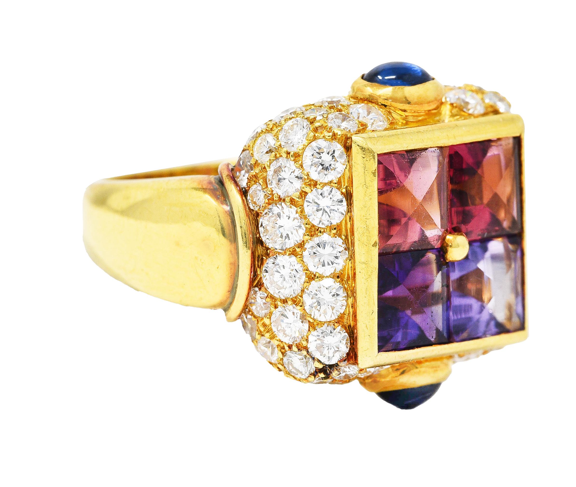Ring features a stylized mystery setting of 5.0 mm buff top square cut gemstones. Featuring lavender topaz, purple amethyst, and pink tourmalines. In a polished gold frame and surrounded by a cushion form with pavé set round brilliant cut diamonds.