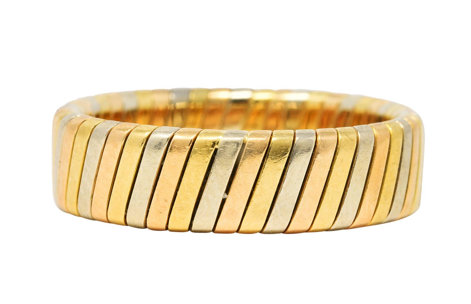 Band ring is deeply ridged with rose, yellow, and white gold

With Italian assay marks for 18 karat gold

Inscribed Made in Italy

Fully signed Bvlgari

From the vintage Tubogas collection

Ring Size: 4 & not sizable

Measures North to South 4.8 mm