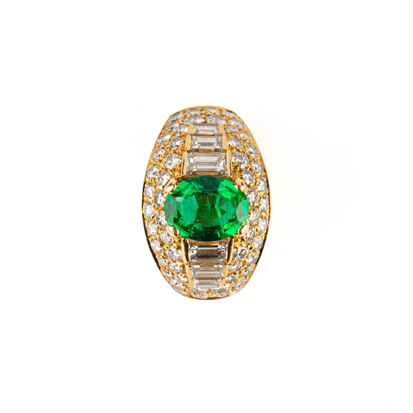 A Bulgari Emerald (1.3 cts) and Diamond Trombino Ring in 18k Yellow Gold. Made in Italy, circa 1975. 

Ring size 5

10.2 grams 
App CTW: 2.11
Emerald: 8.76 x 6.71 x 3.69 - 1.30 carats 