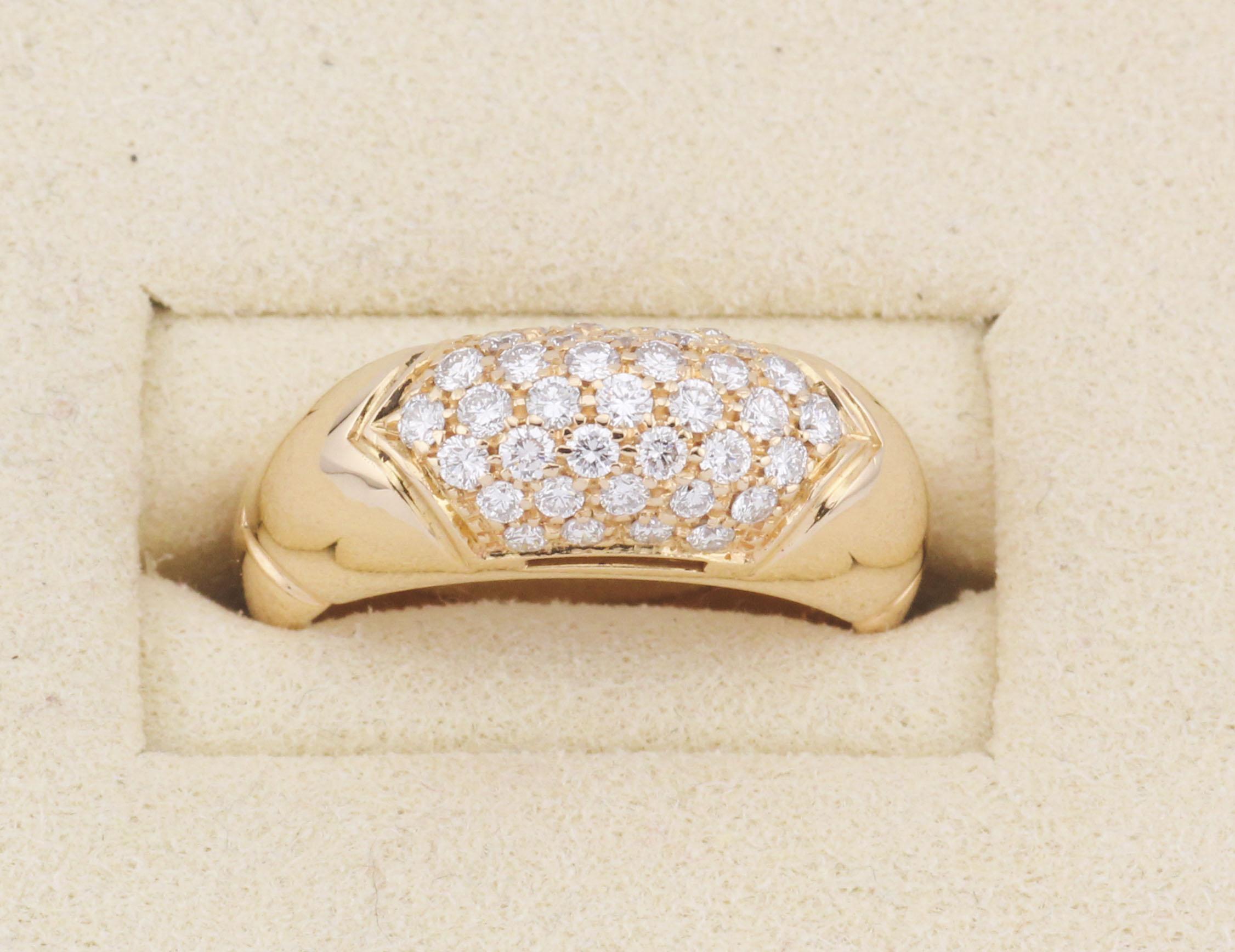 A bold fusion of Italian glamour and sculptural design, the Bulgari Tronchetto Ring is a striking statement piece rooted in the house’s iconic aesthetic. Crafted in rich 18k yellow gold, the ring showcases a signature domed silhouette—its sleek,