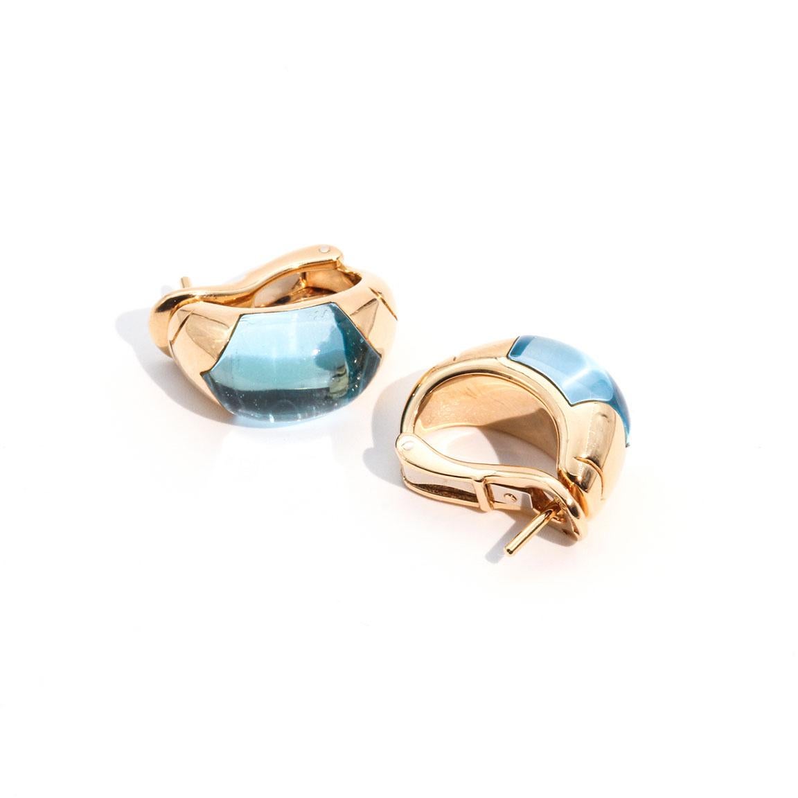 This stunning pair of 18 carat yellow gold Bvlgari Tronchetto earrings boast two beautiful central topaz modified cabochons. The Bvlgari Tronchetto earrings are presented in their original Bvlgari box. These Bvlgari Tronchetto earrings are elegant