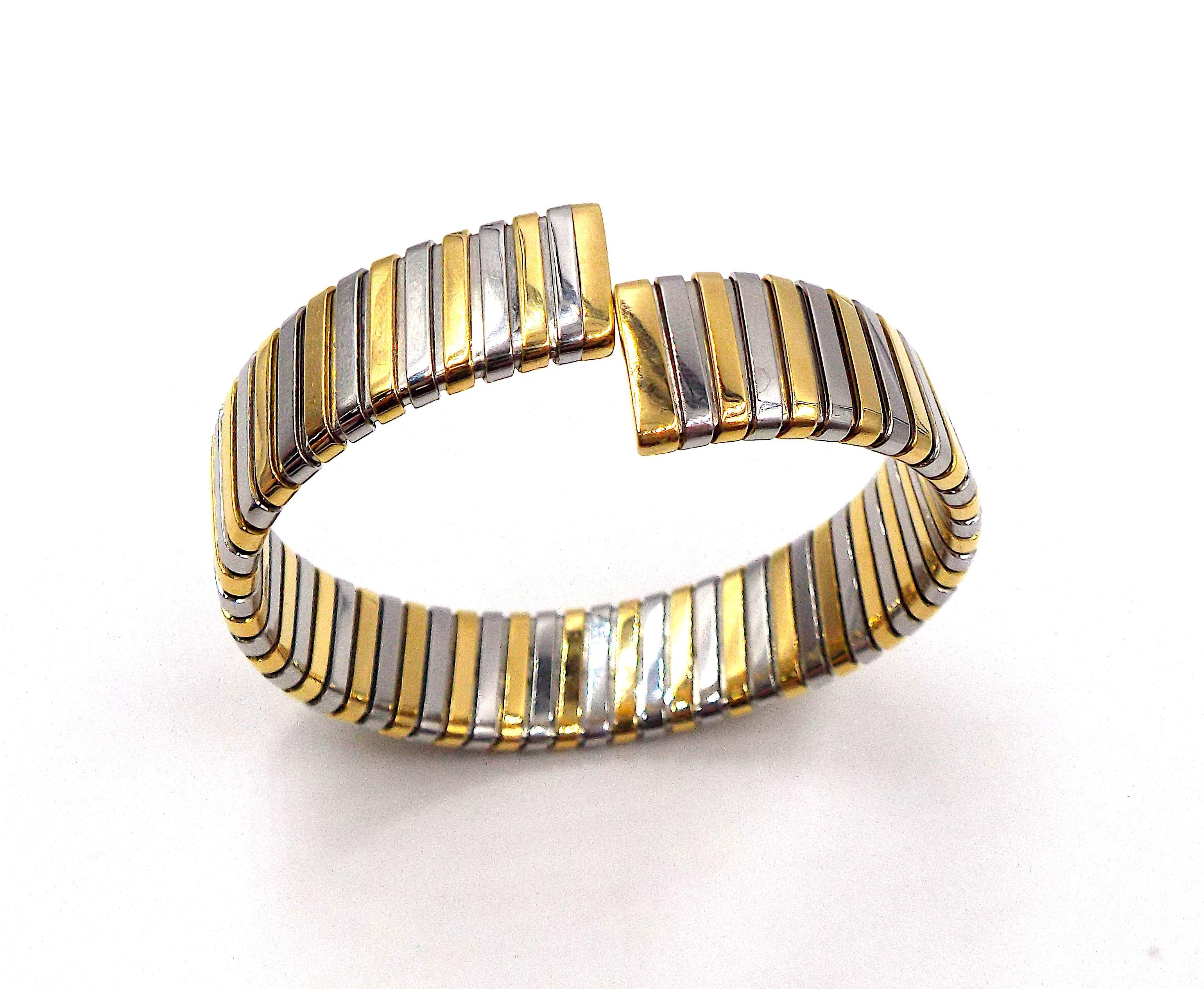 A stylish flexible cuff bracelet made of steel and 18K yellow gold by Bulgari. Gross weight 40.2g, inner circumference approximately 6