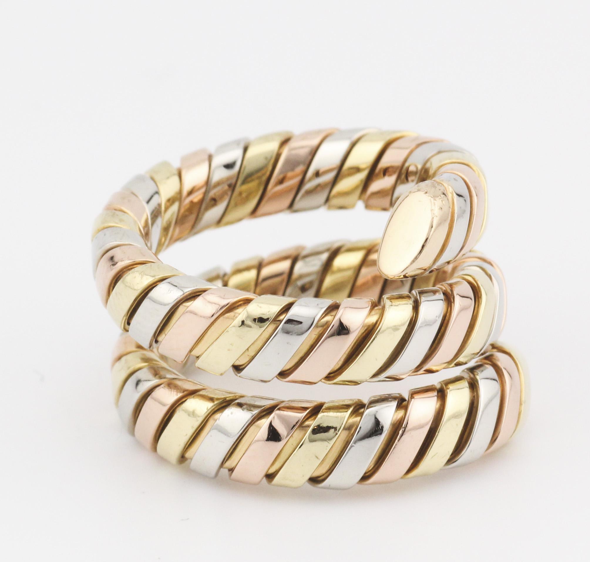 Introducing the Bulgari Tubogas 3 Color 18K Gold Flexible Snake Ring—a mesmerizing blend of iconic design and luxurious craftsmanship from the esteemed Italian jewelry house, Bulgari. This ring is an exquisite representation of the Tubogas