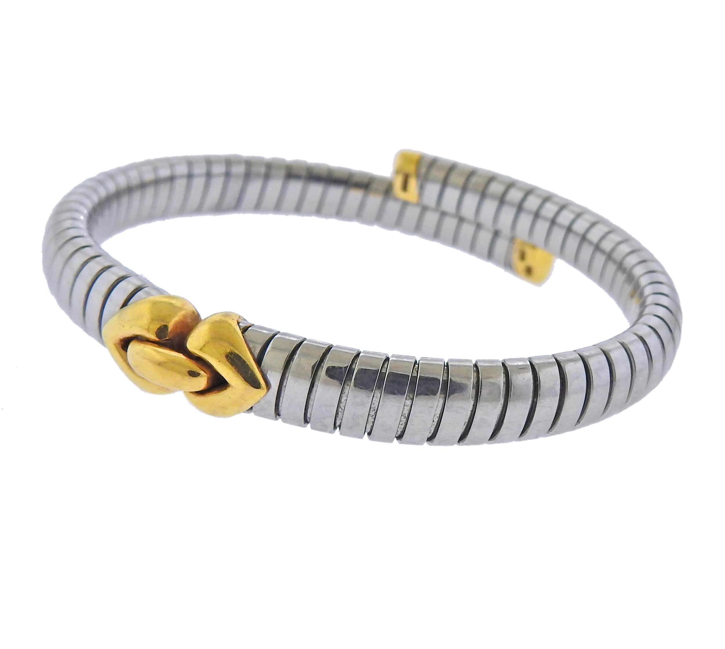 18k gold and steel Alveare Tubogas bracelet by Bvlgari. Bracelet will fit approx. 7