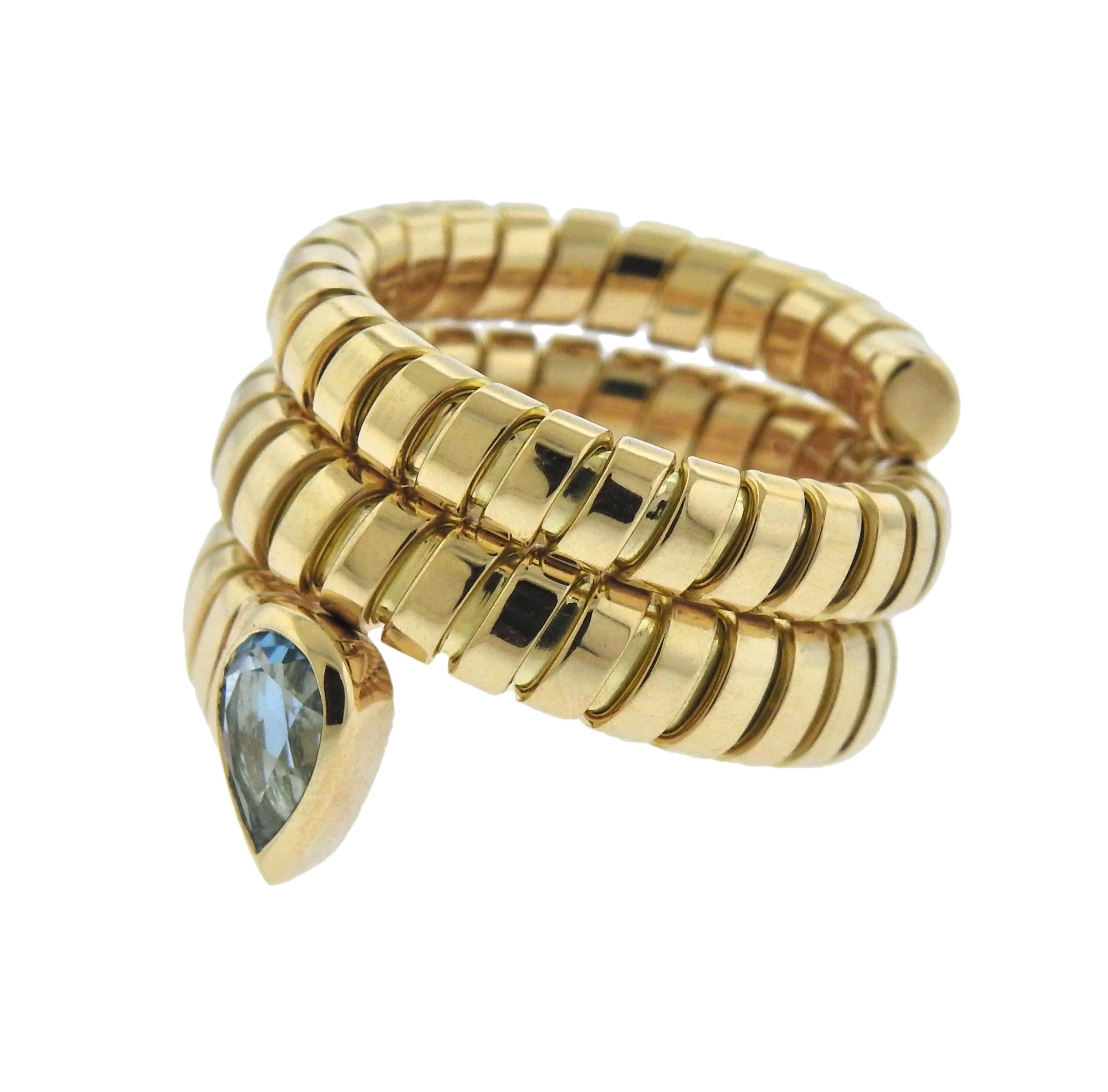 18k gold Tubogas wrap ring by Bulgari, set with blue topaz. Ring size - 6 (slightly flexible construction), ring is 17mm wide, weighs 16.2 grams. Bvlgari, 750, Italian mark.