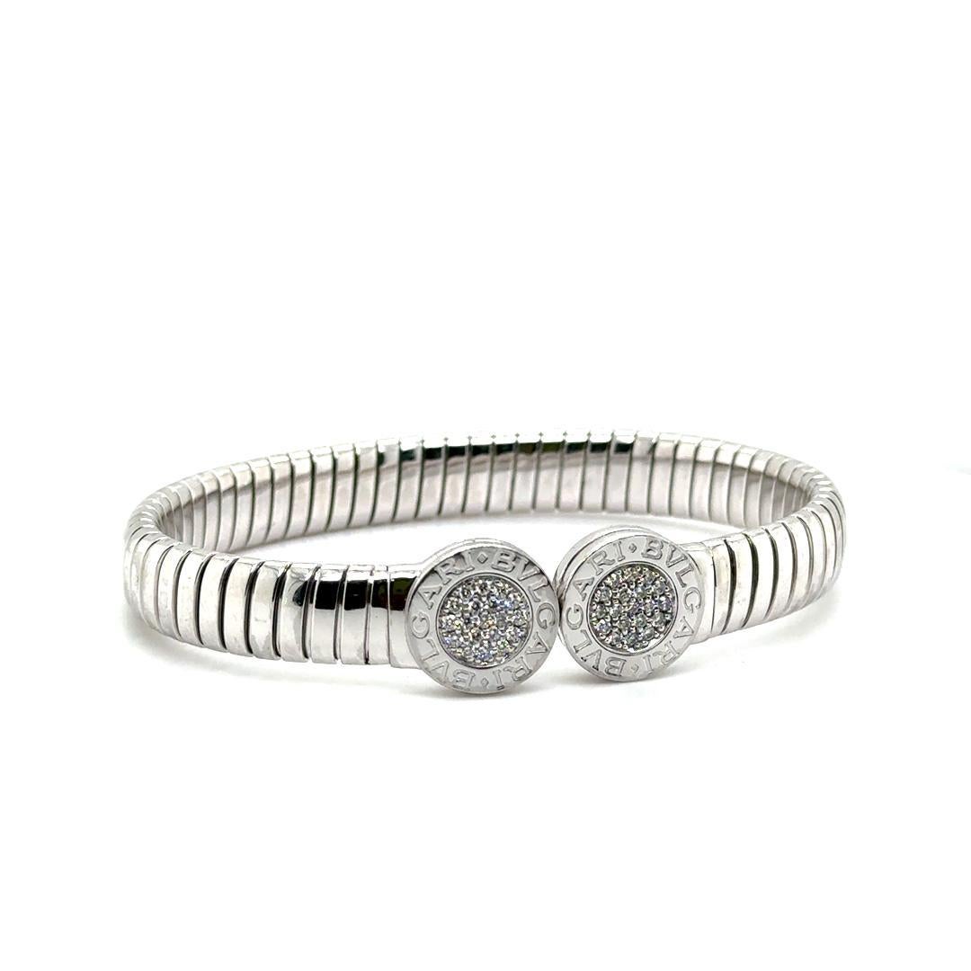 Beautiful cuff bracelet from famed designer Bulgari. From the Tubogas collection this elegant cuff design is crafted in stainless steel and highlights round brilliant cut diamonds. The bangle shows a flex fix design and is easy to take on and off.