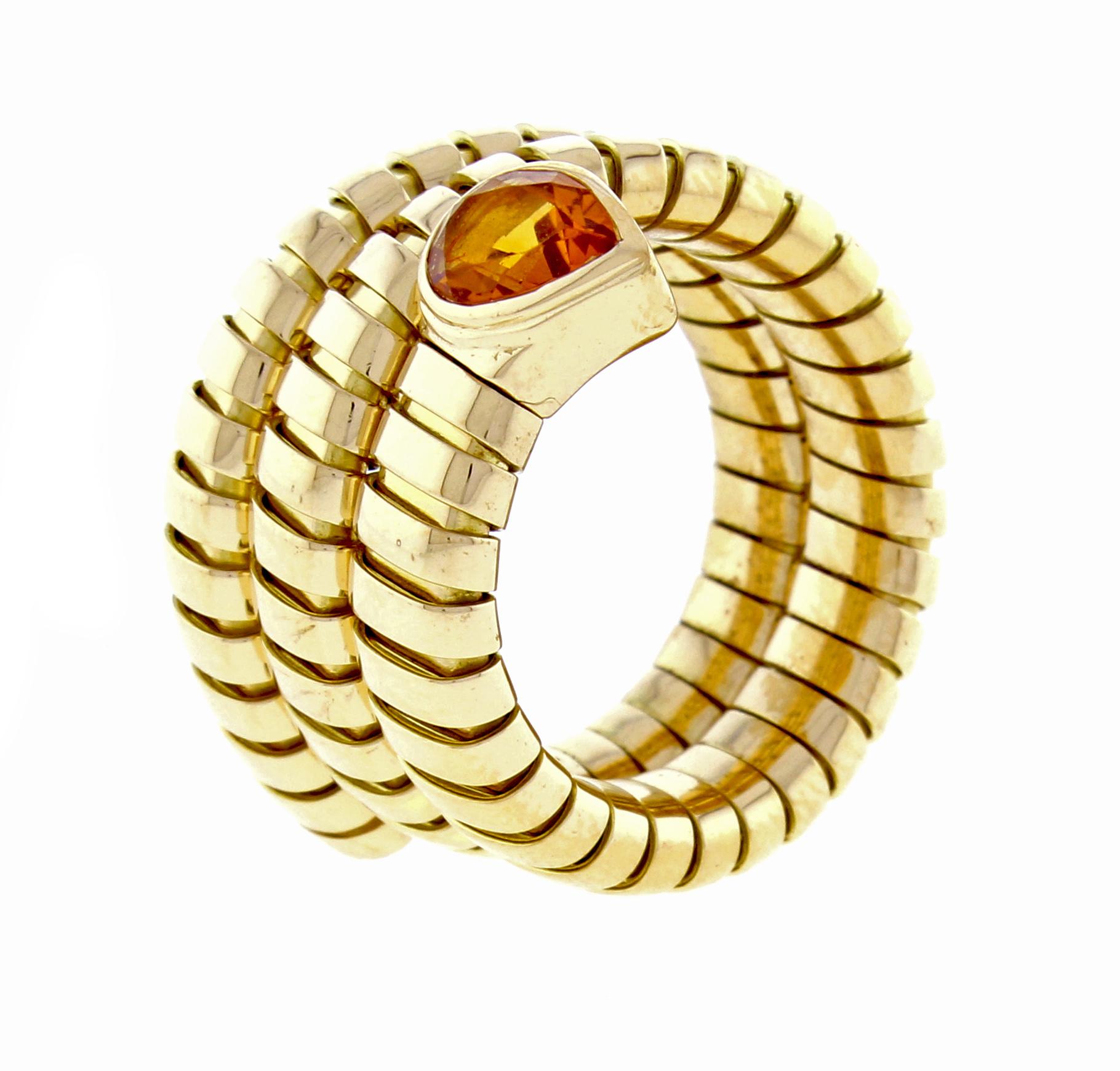 From Bulgari's iconoc Tubigas collection, thier triple coil Tubigas wrap ring. The  18 karat gold ring features a rich pear-shape citrine. Size 7,  15.3 grams