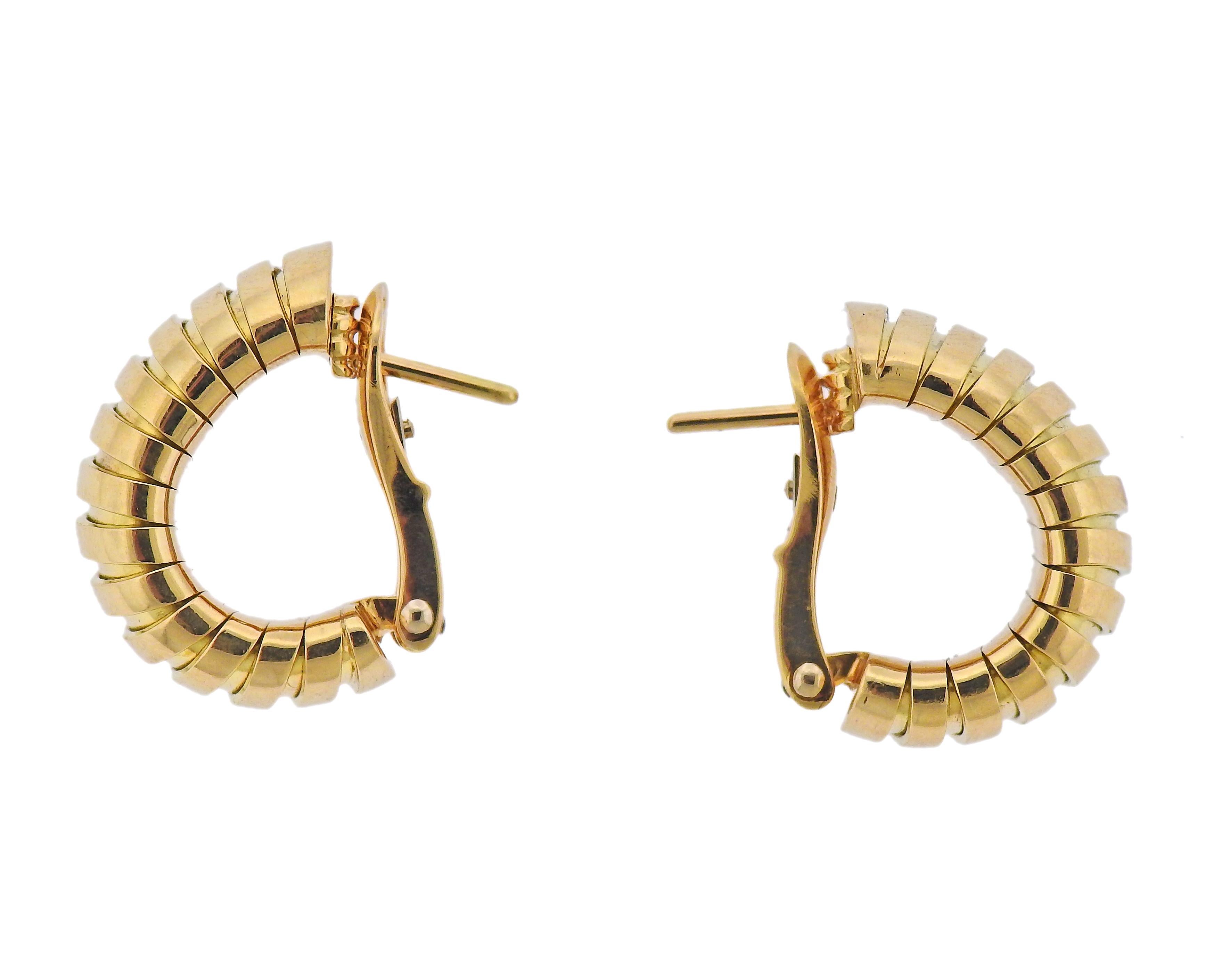Pair of 18k yellow gold Tubogas half hoop earrings by Bvlgari. Earrings are 22mm x 11mm wide. Marked: Bvlgari, 750, Italian mark. Weight - 28.3 grams. 