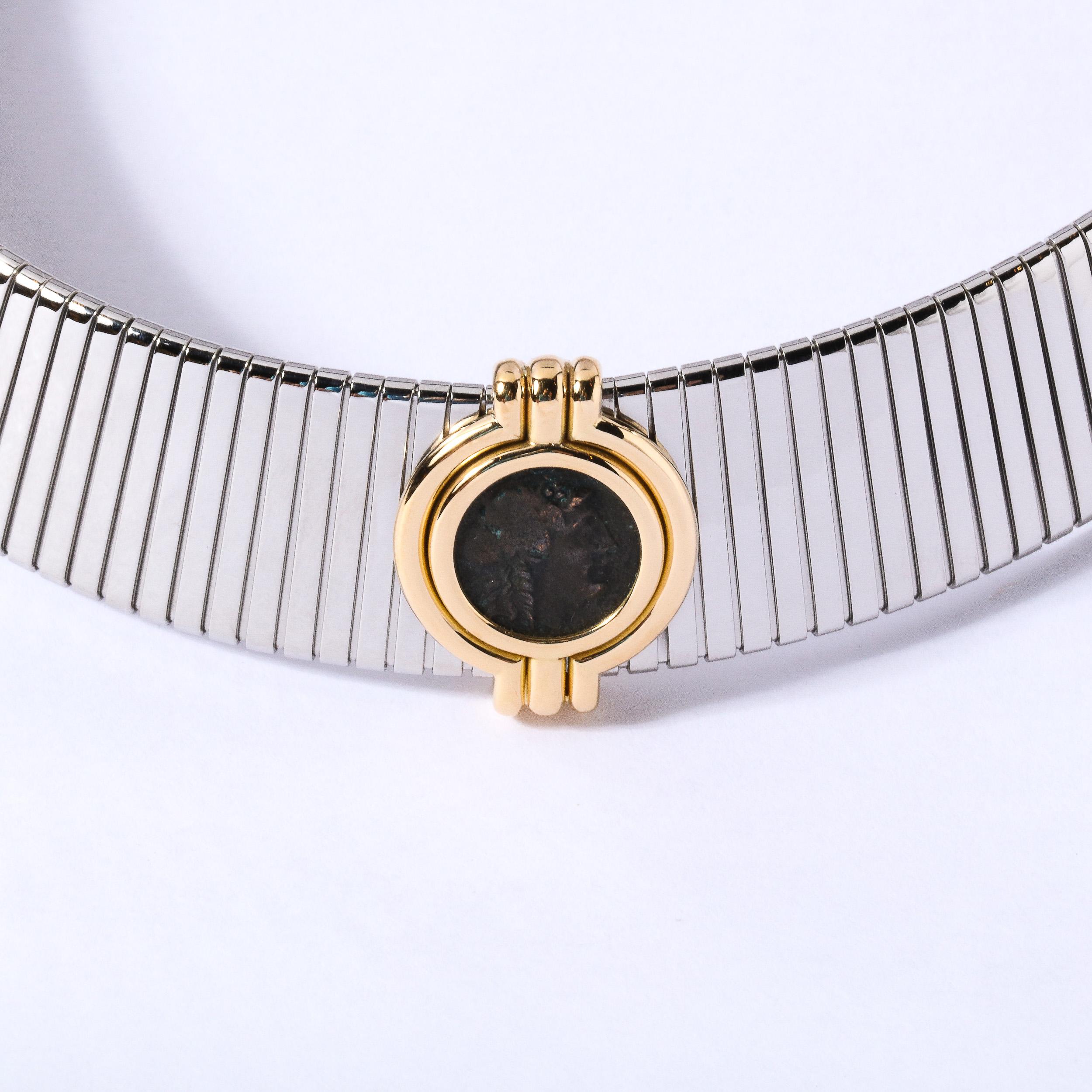 This stunning necklace is made of 18k gold and steel. Tubogas necklace from Monete collection set with ancient Greek coin meticulously crafted by Bulgari .Necklace is 18 inches long and 20 mm wide adjustable to fit any neck size. Weight is 95.4
