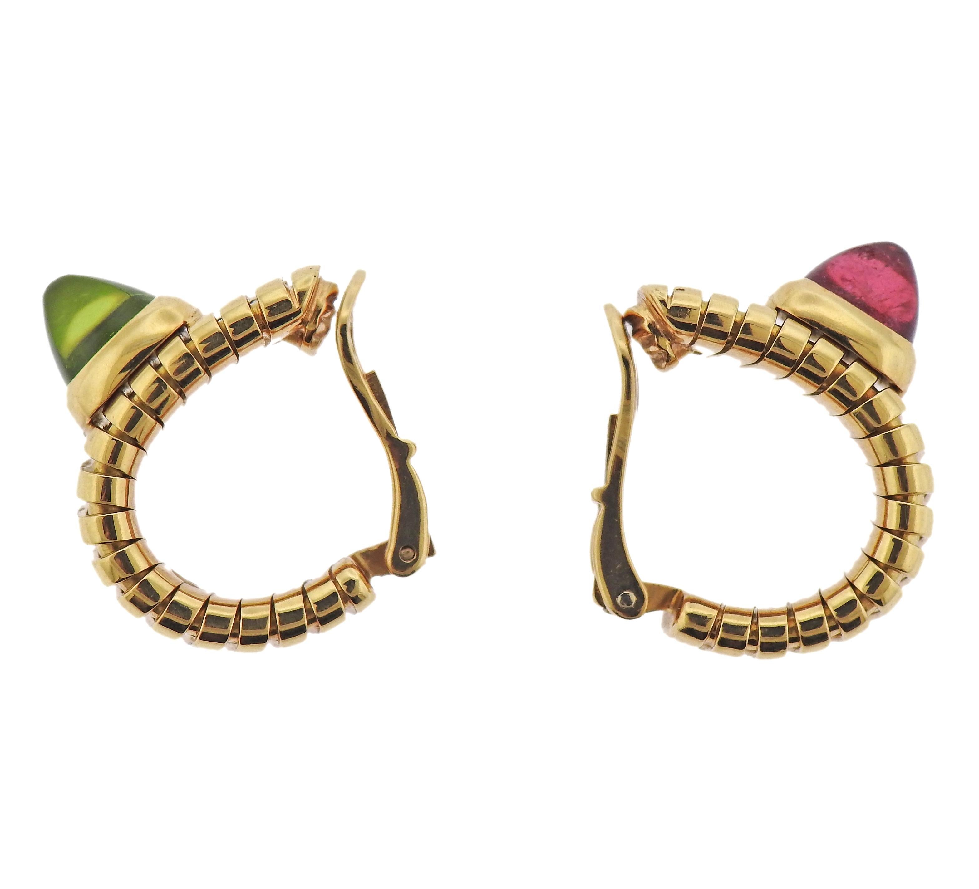 Pair of iconic Tubogas hoop earrings by Bvlgari, with sugarloaf cut pink tourmaline (small chip on the stone) and peridot. Earrings measure 20mm x 11mm. Marked: Bvlgari, 750, Italian mark, BA1414. Weight - 26.9 grams.