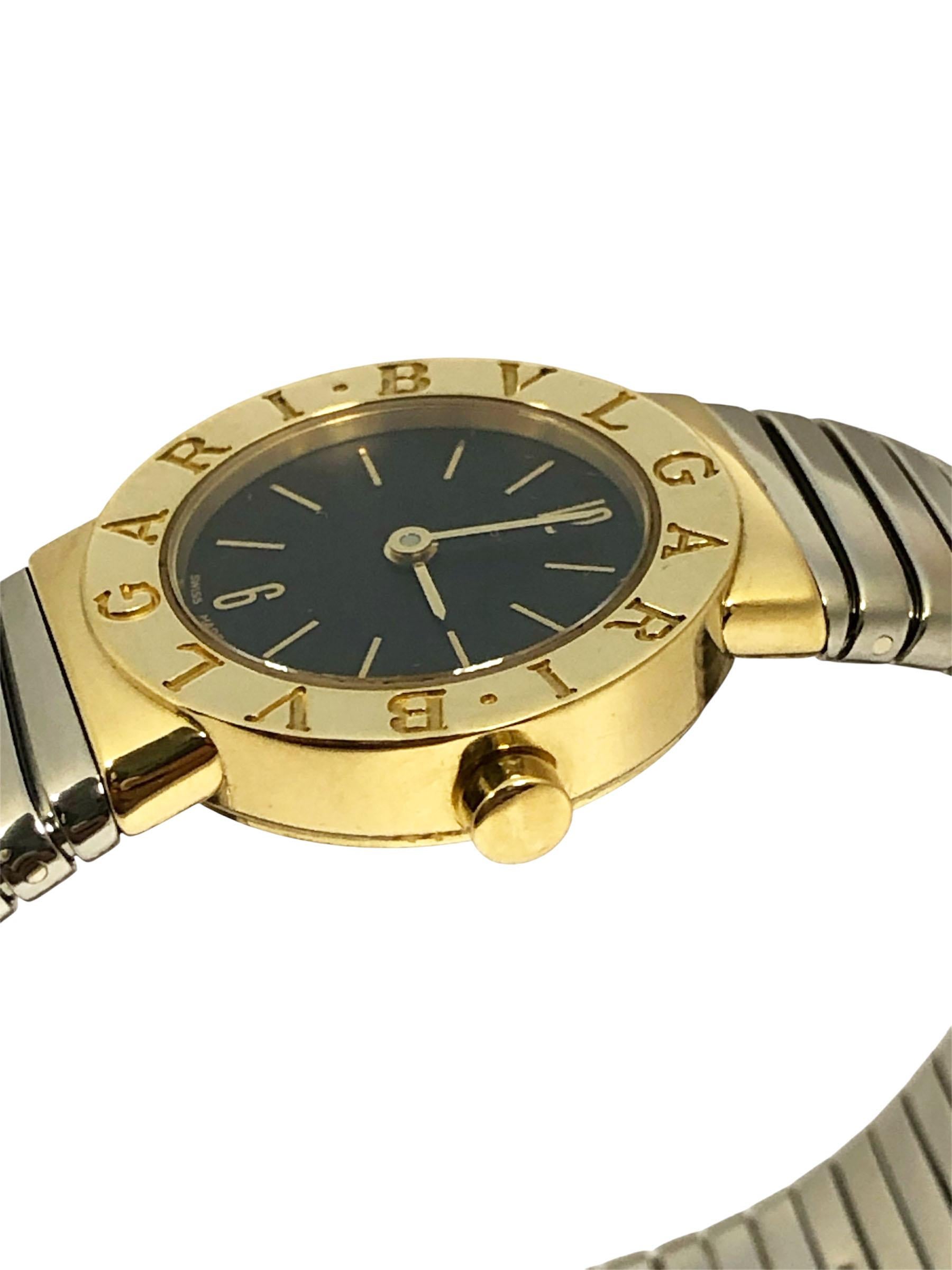Circa 2005 Bvlgari Tubogas Ladies BB 23 2T Wrist Watch, 23 M.M. 18k Rose Gold 2 Piece case, Quartz movement, Black Dial, Stainless steel with 18k Gold end pieces 5/8 inch wide flexible bracelet. Wrist size 5 1/2 to 6 1/2 inches. Recently serviced