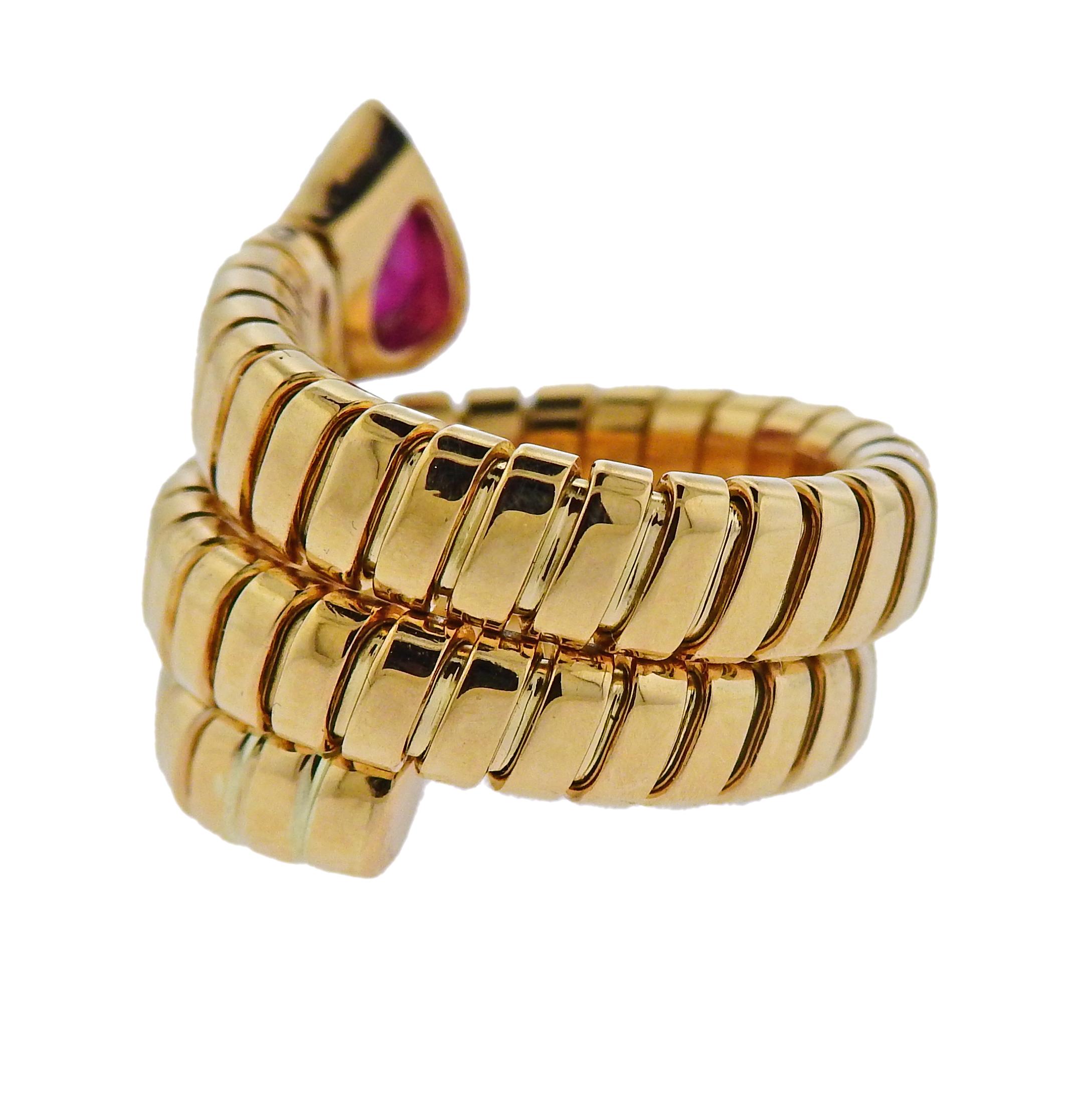 18k yellow gold wrap ring crafted by Bulgari for the Tubogas collection. Features ruby.  Ring size 6 (slightly flexible) width- 18mm wide. Weighs 16.2 grams.  Marked: Bulgari 750 Italian Marks.