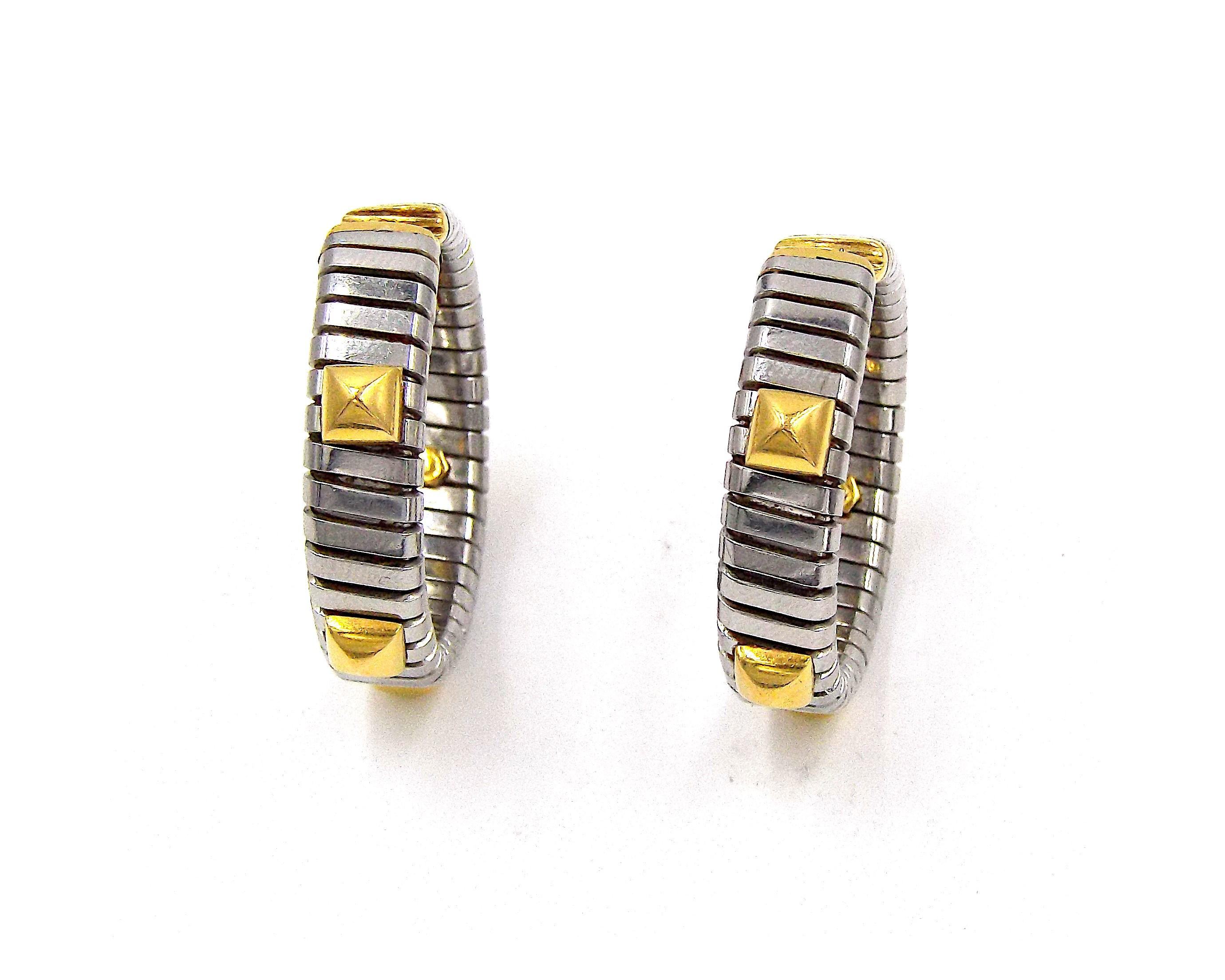 A pair of stainless steel and 18K yellow gold hoop earrings by Bulgari. Gross weight 13.2g each, approximately 1.5