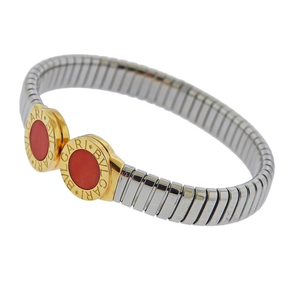 Iconic Tubogas 18k gold and stainless steel bracelet by Bvlgari, set with corals. Bracelet will fit approx. 7