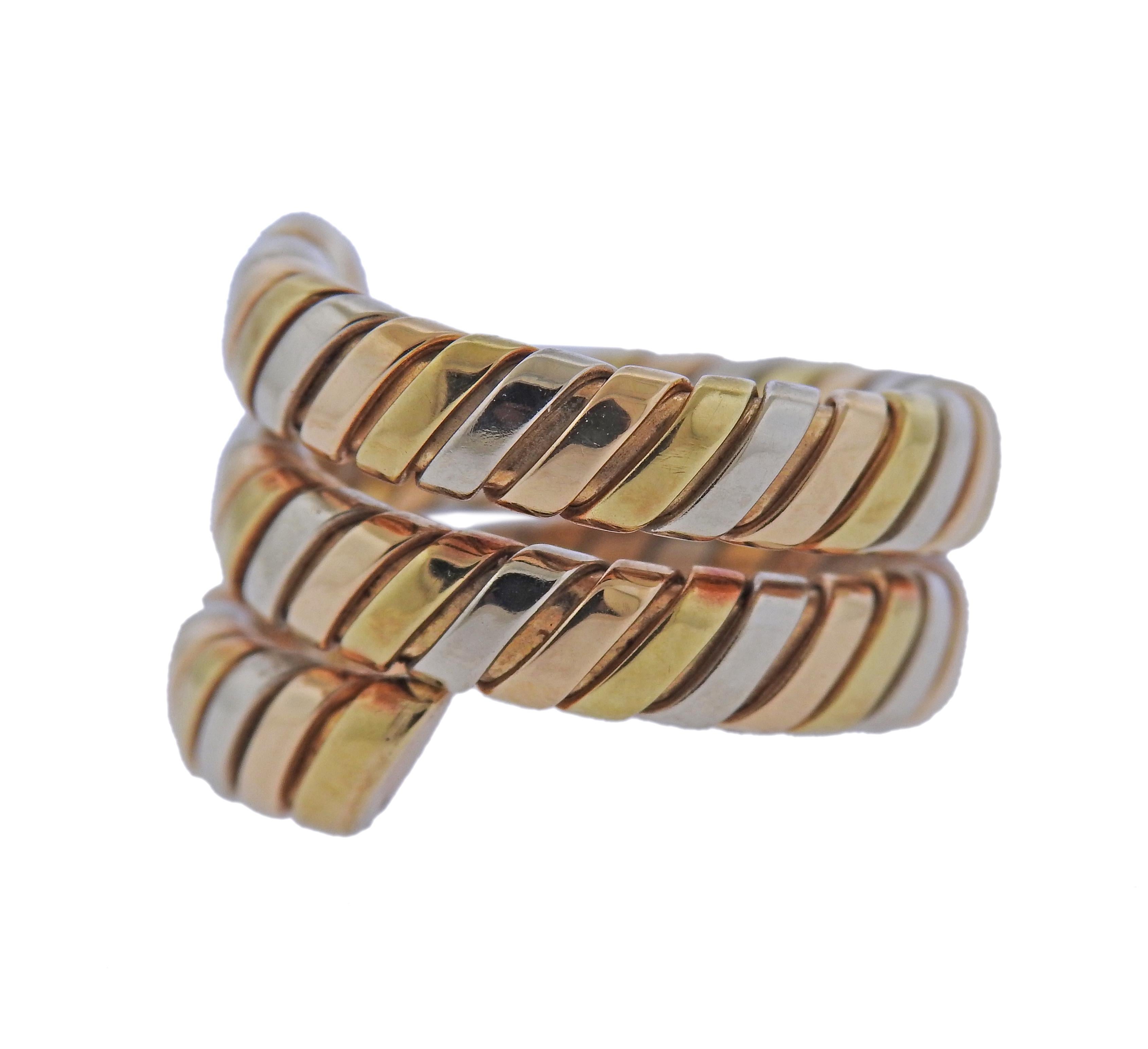 18k tri color gold Tubogas wrap ring by Bvlgari. Ring size - 7 (slightly flexible construction), ring is 17mm wide. Weight - 15 grams. Marked: Bvlgari, Italian mark, 750. 