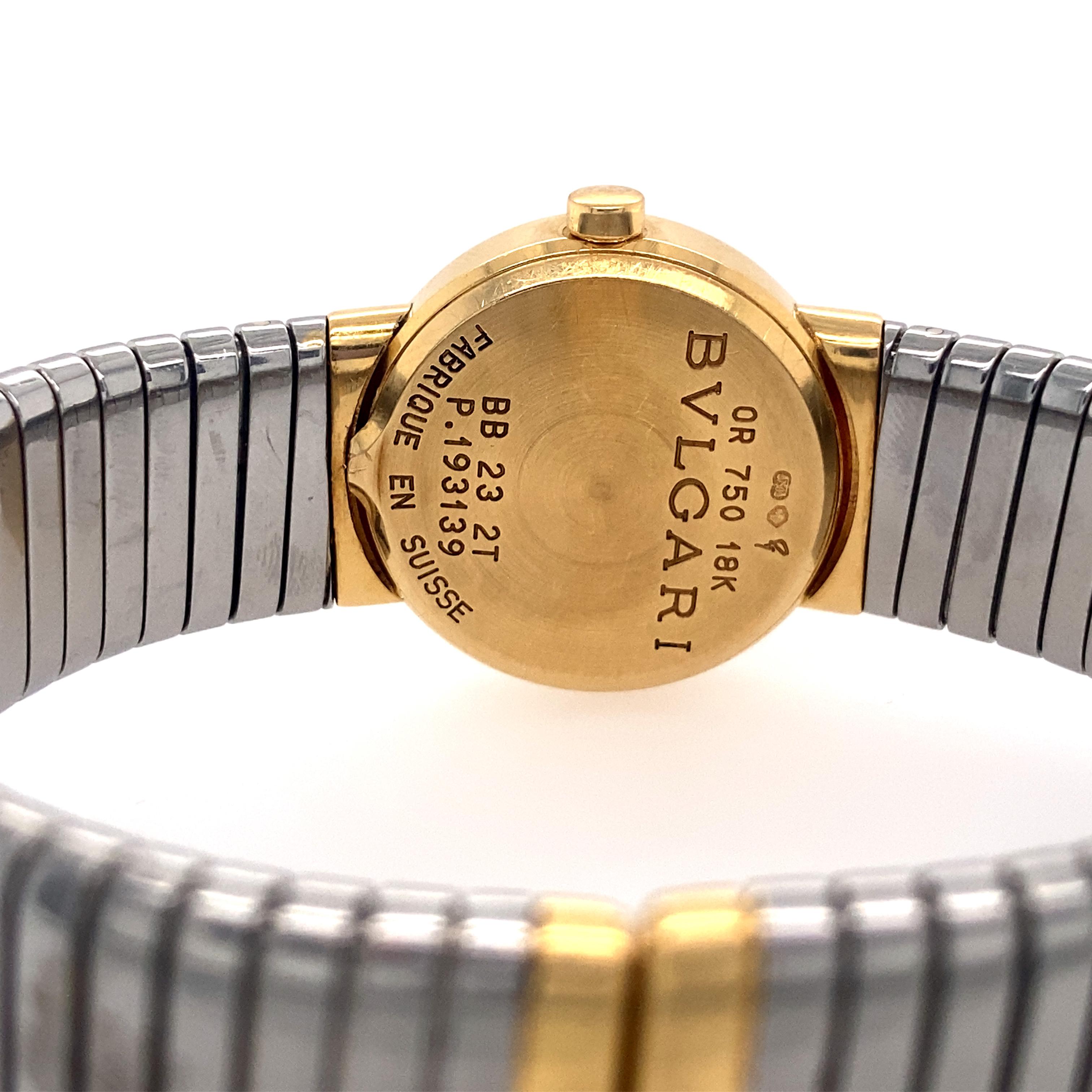 Bulgari Tubogas bracelet watch, featuring a Swiss-made quartz movement; black dial with gold hands and hour markers; and 23mm, 18k yellow gold and stainless steel case with an 18k yellow gold bezel on a 'Tubogas'-style, stainless steel tension