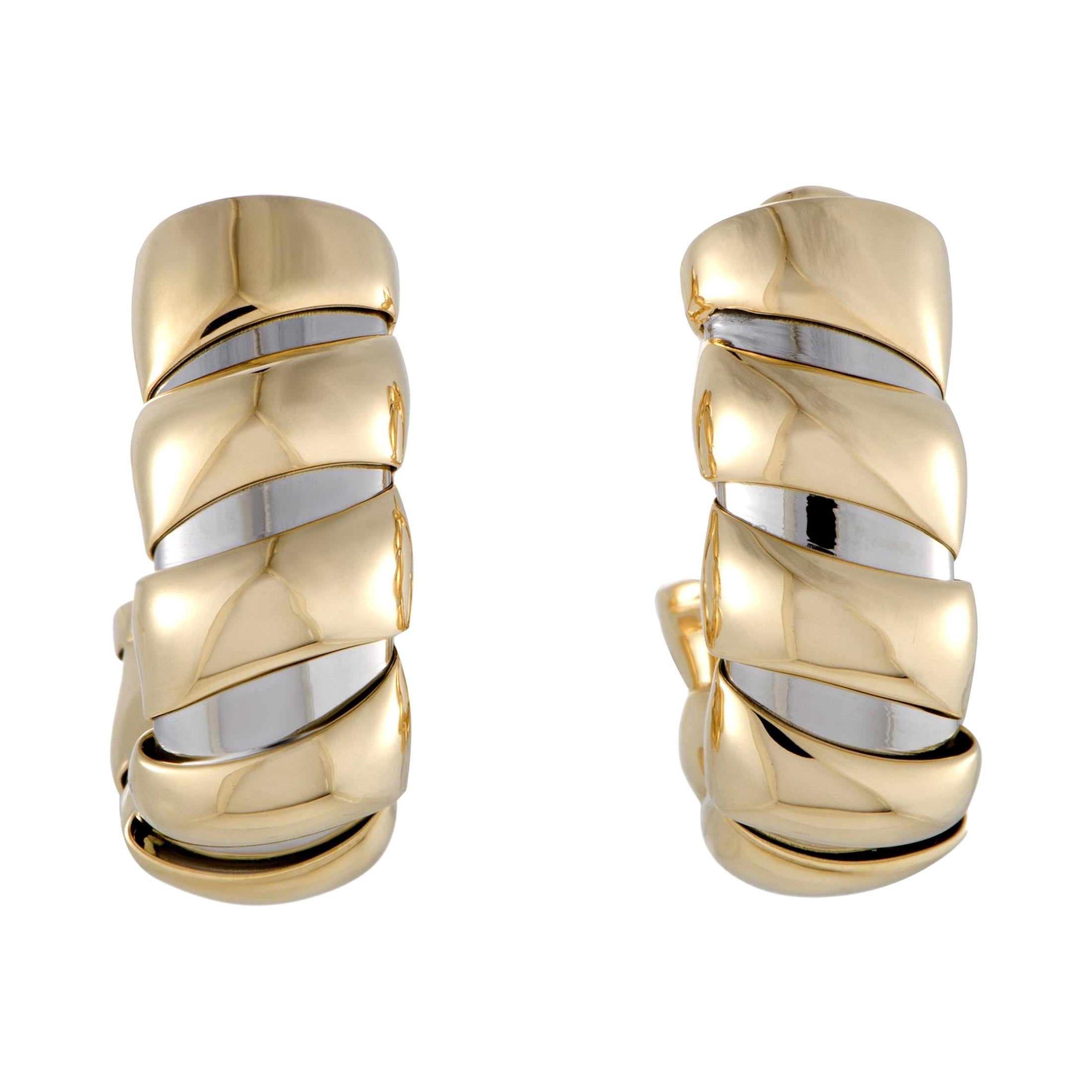 The acclaimed Bvlgari design codes are featured in this stunning pair of earrings whose bold style and offbeat choice of materials combine into creating a compellingly fashionable look. The earrings are expertly crafted from 18K yellow and 18K white