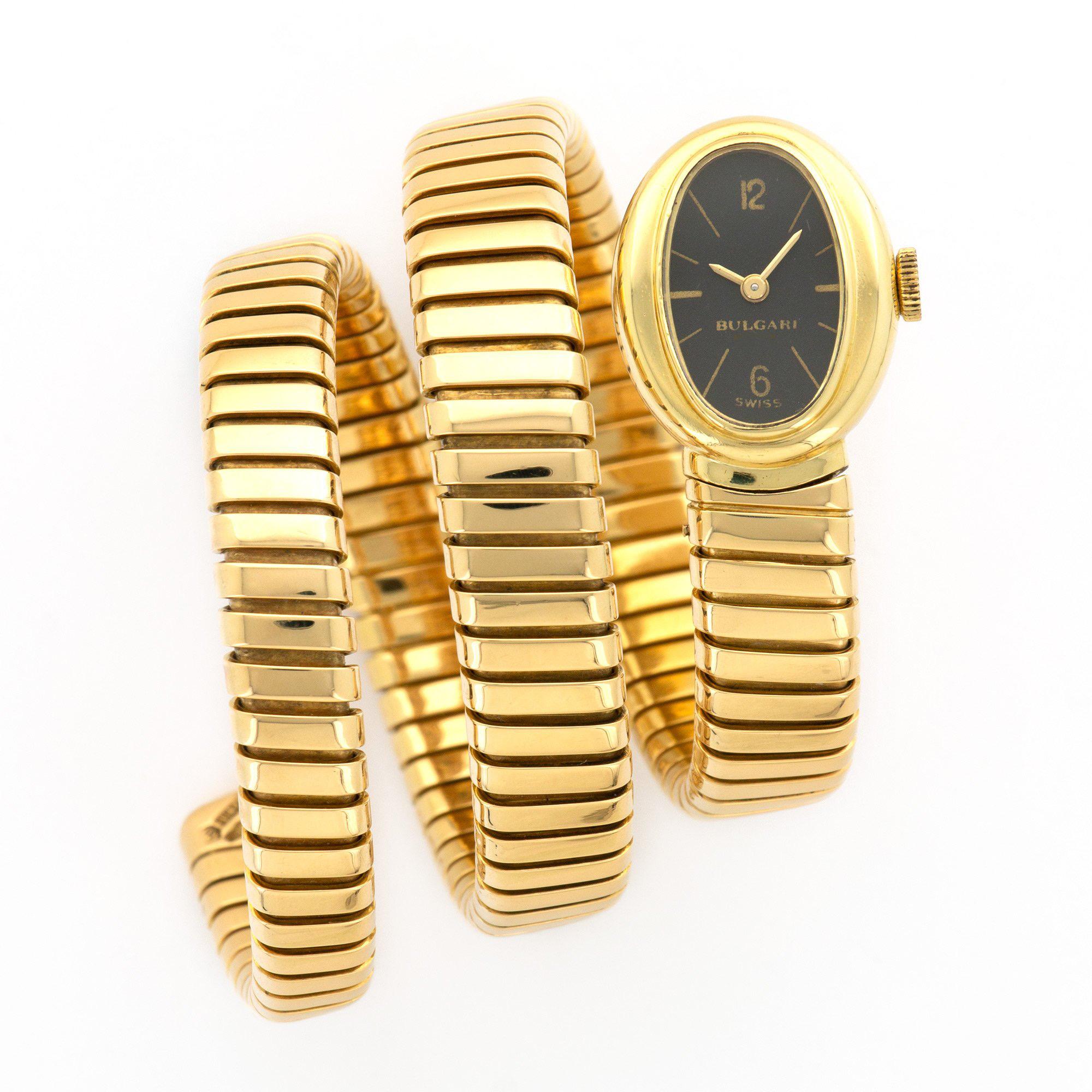 A chic 18 karat yellow gold Tubogas bracelet watch by Bulgari featuring a black dial. Made in Italy, circa 1970s.