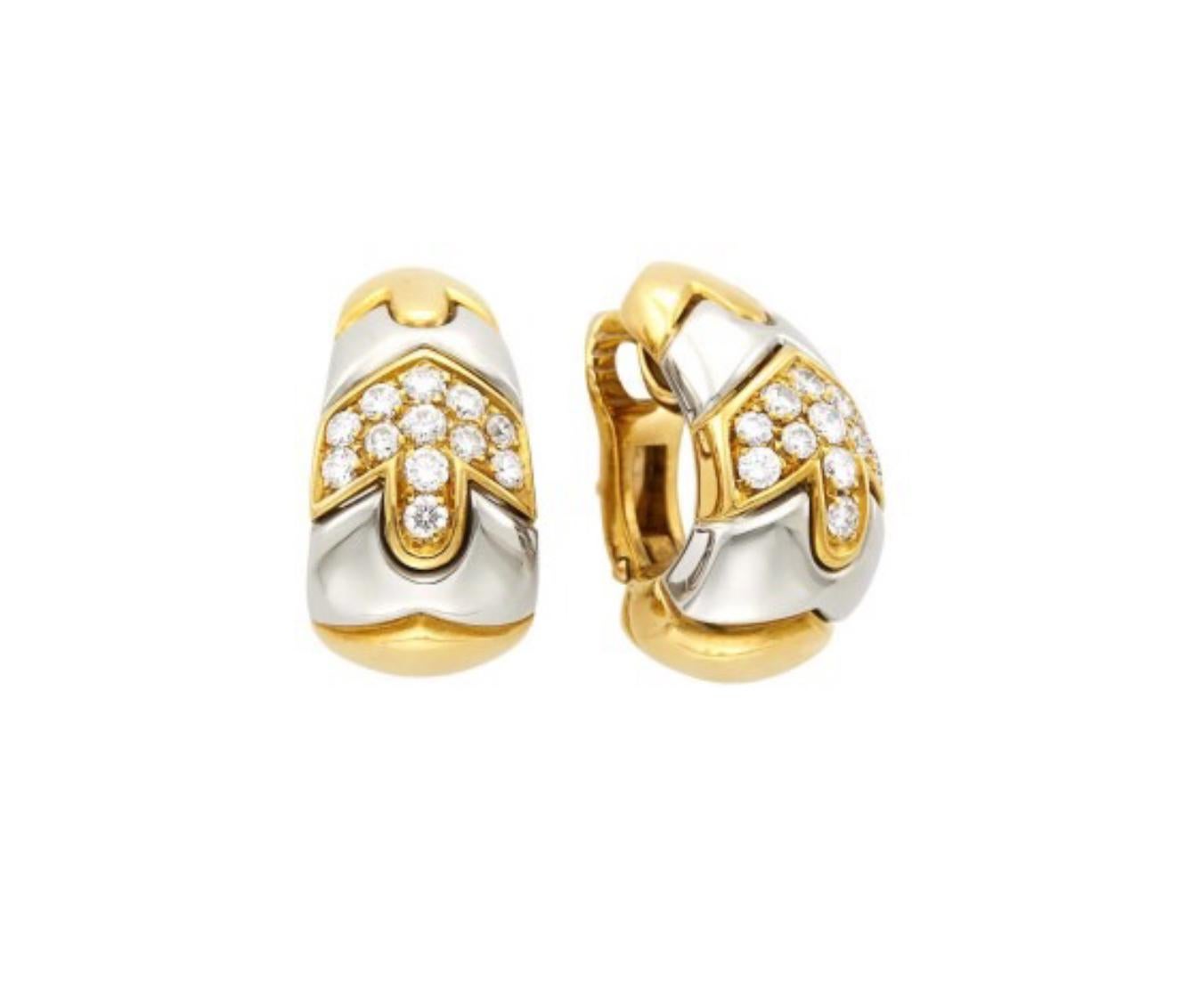 A chic pair of Bulgari two-color 18 karat gold earclips featuring 24 round diamonds totaling approximately 1.10 cts. Weight approximately 14.6 dwts. Made in Italy circa 1980. Measure 15/16 x 1/2 to 3/8 inch.