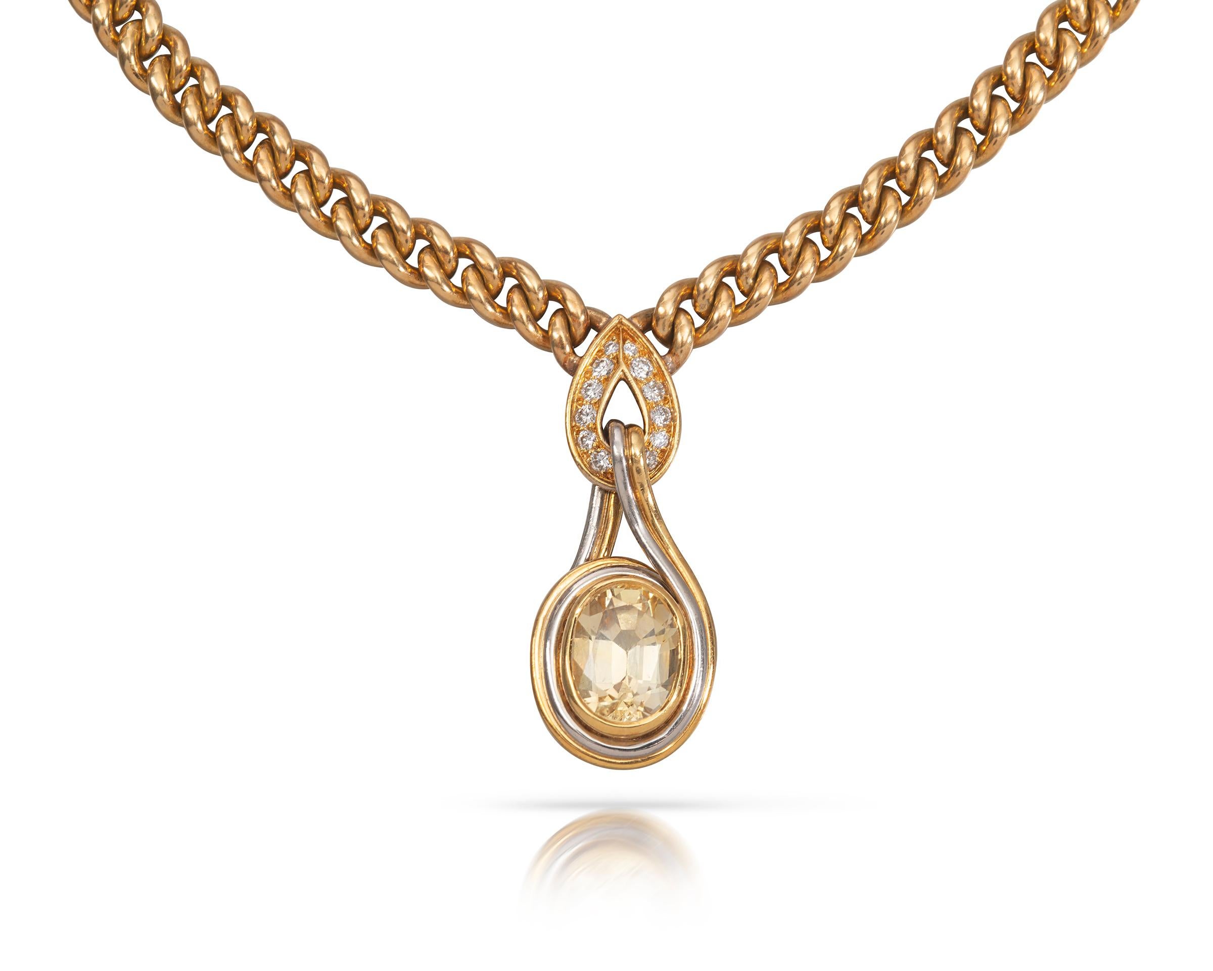 A unique Bulgari yellow sapphire and diamond necklace set in 18 carat yellow gold. The heavy belcher linked yellow gold chain suspends a diamond encrusted pendant that centres a natural untreated yellow sapphire of approximately 7.6 carats.
The