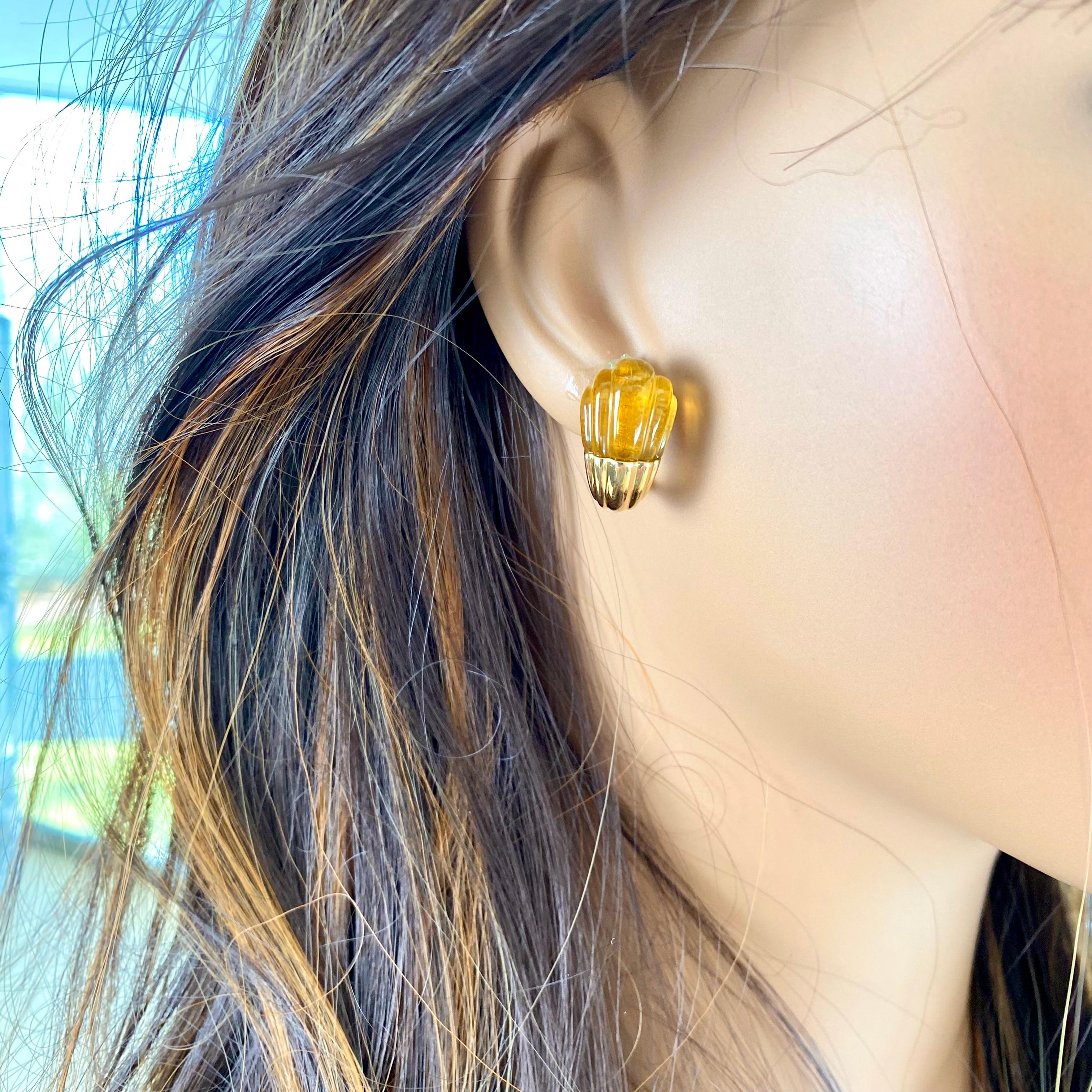 Introducing the epitome of elegance and luxury: these exquisite Bulgari 18k Yellow Gold Carved Cabochon Citrine Clip-On Earrings are a testament to timeless sophistication. Crafted with meticulous attention to detail, these earrings are adorned with