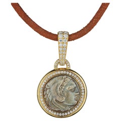 Bulgari Collier vintage en or avec pièce de monnaie ancienne en argent et diamants
