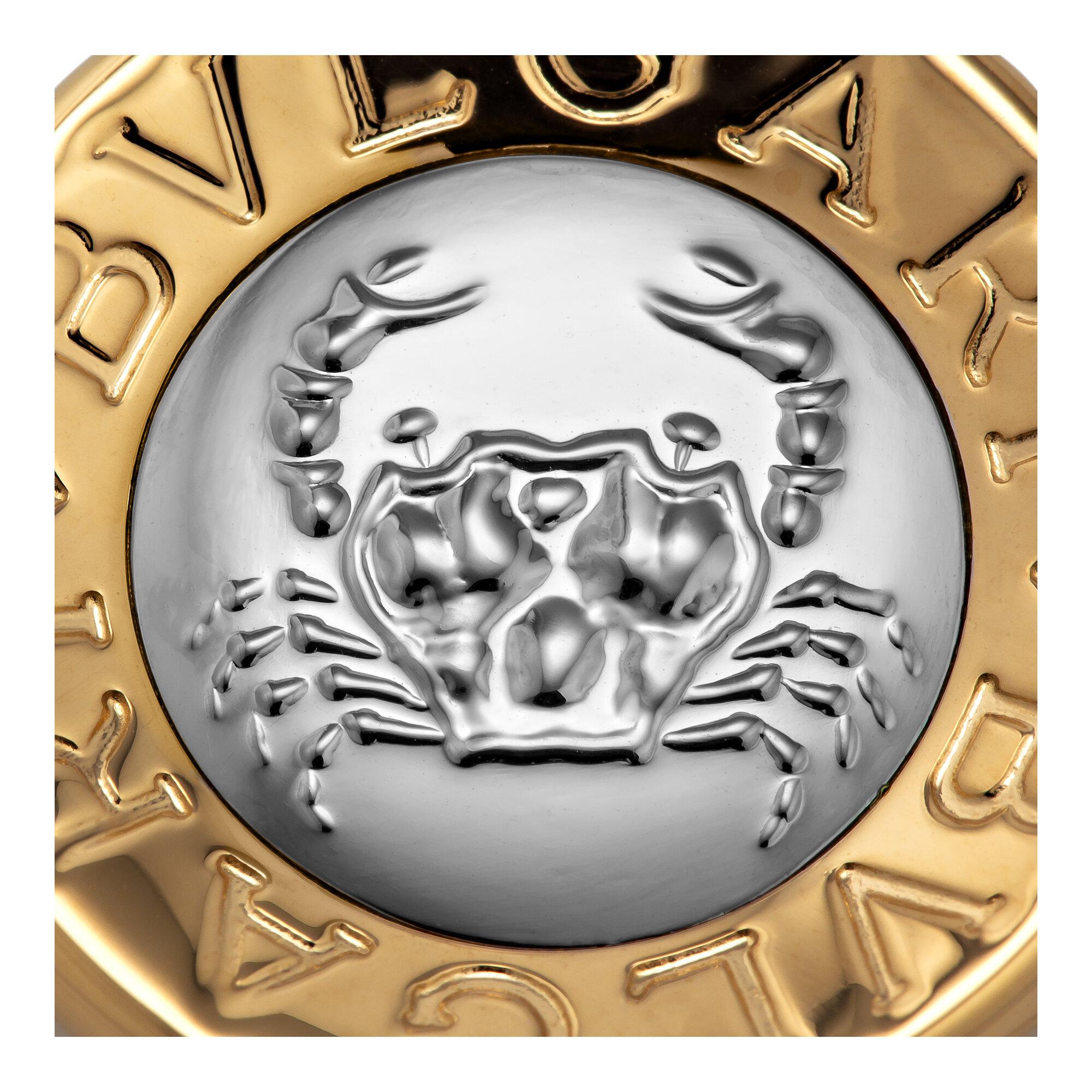 The zodiac Cancer sign of the crab weaves easily between both the sea and the shore representing this symbol's ability to adapt to all types of earthly situations.   And by wearing this Bulgari 18 karat white and yellow gold crab Cancer sign pendant