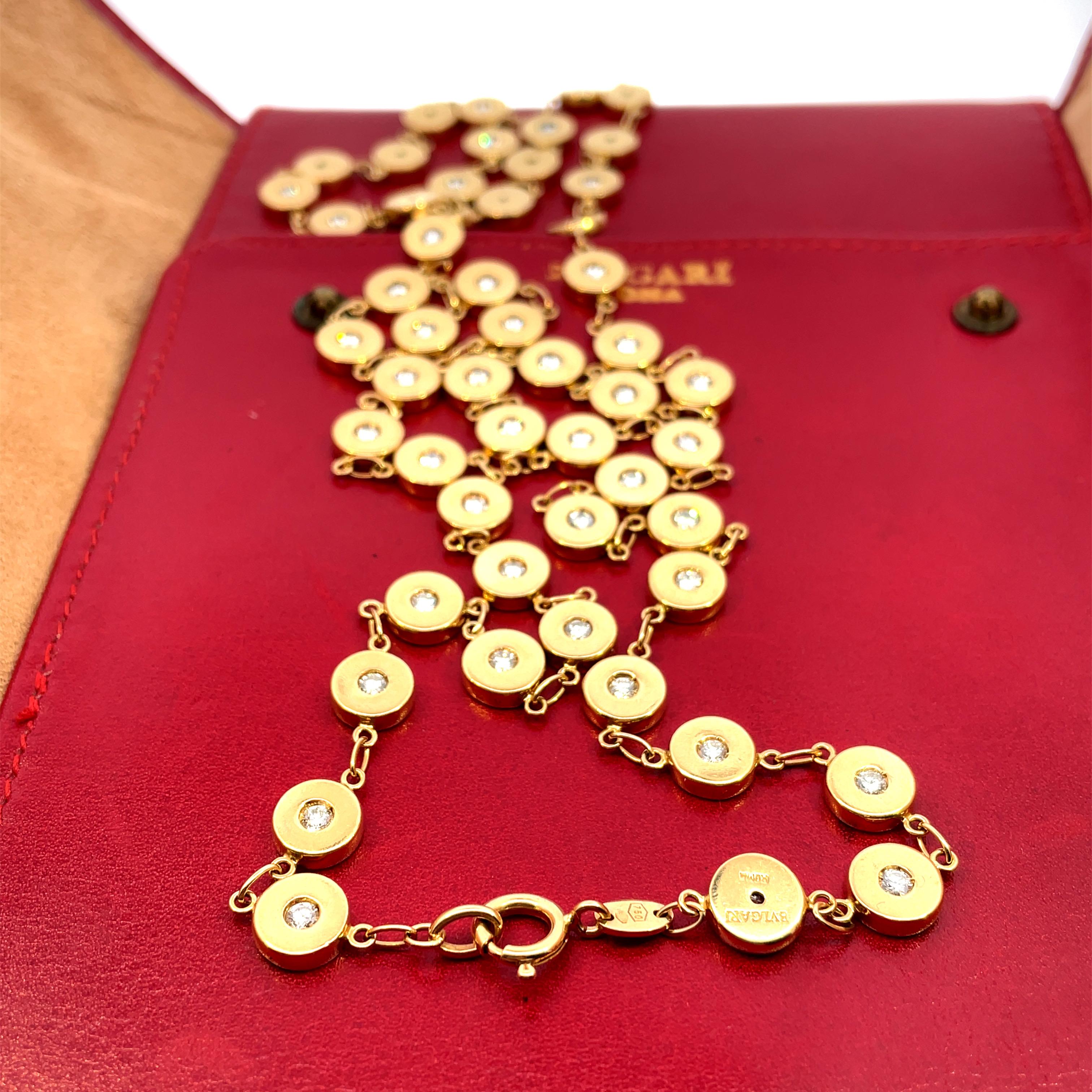 Rare and Unusual Vintage Bulgari gold and diamond long-chain, 80 cm longh can be worn in many different eclectic ways. 
Each one of the 53 round sections is embellished by a fine Round Diamond F/G color Vvs clarity for a total weight  of 6,30